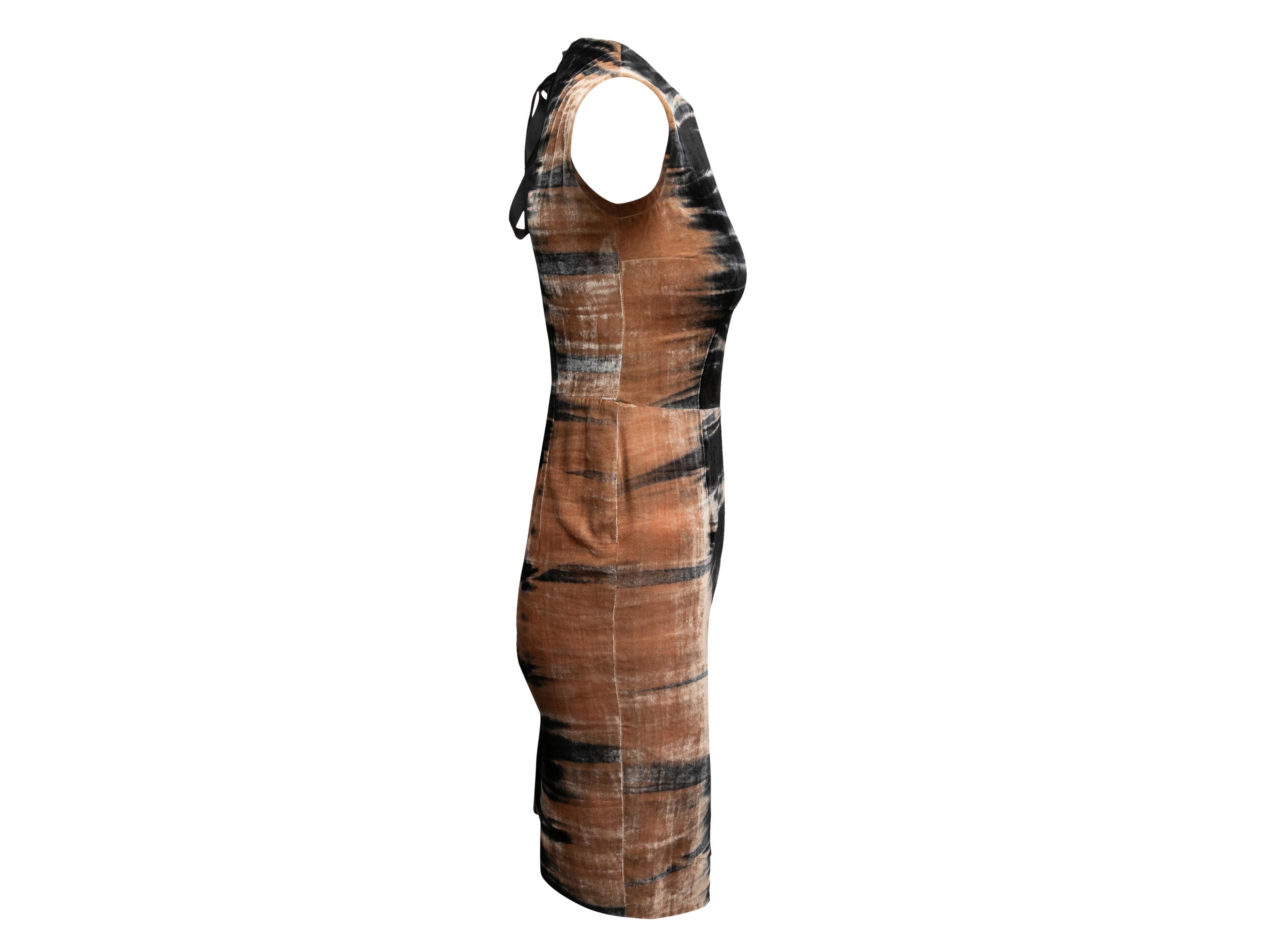 Black and peach velvet patterned sleeveless dress by Prada. Crew neck. Tie closure at nape. 28