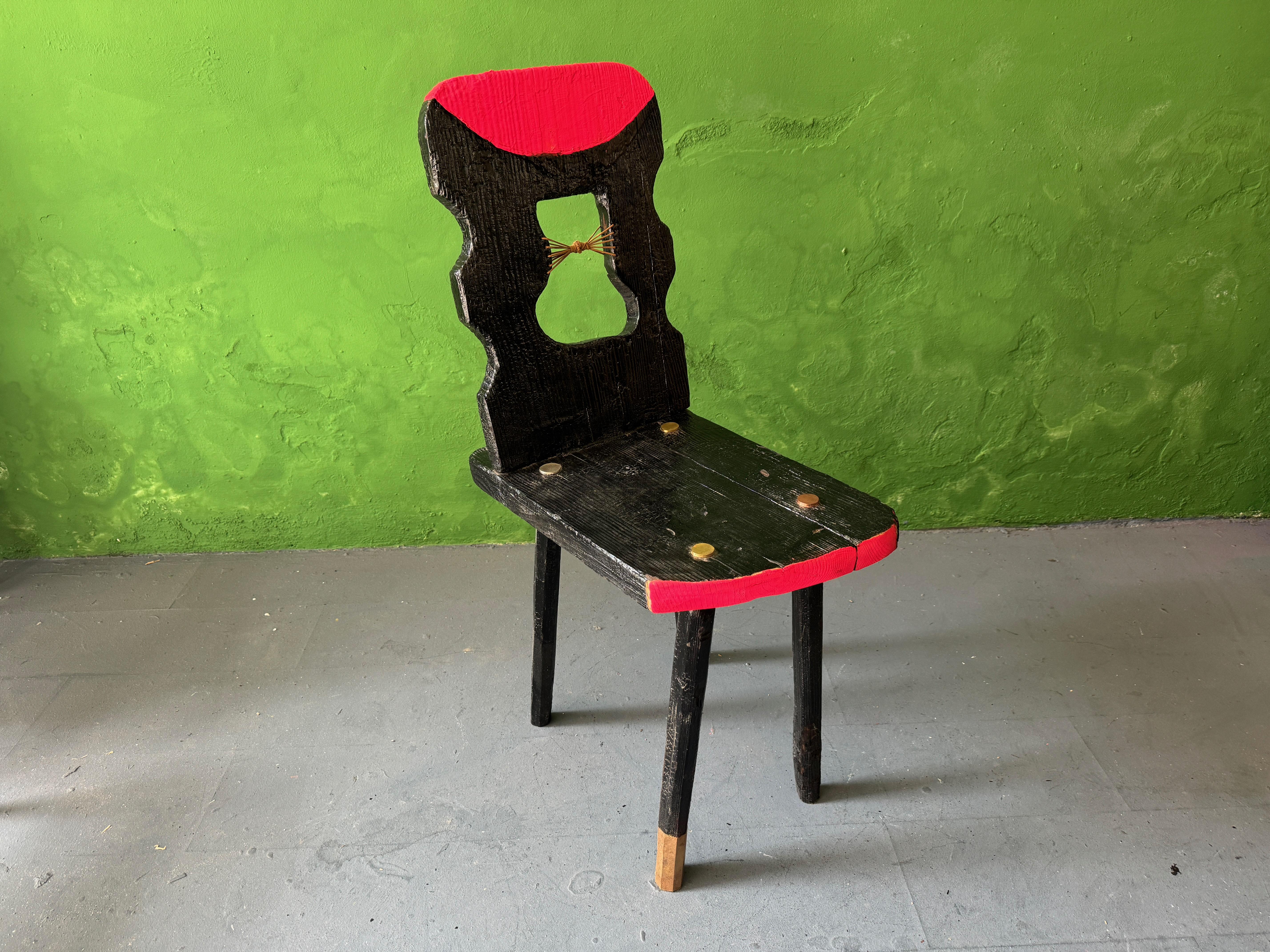 Black Peak Of A Century Chair by Markus Friedrich Staab
One of a Kind
Dimensions: D 37 x W 58 x H 95 cm.
Materials: Wood, paint, leather, brass.

This Austrian Brettstuhl was burned, lacquered, cutted and painted to give the traditional design a