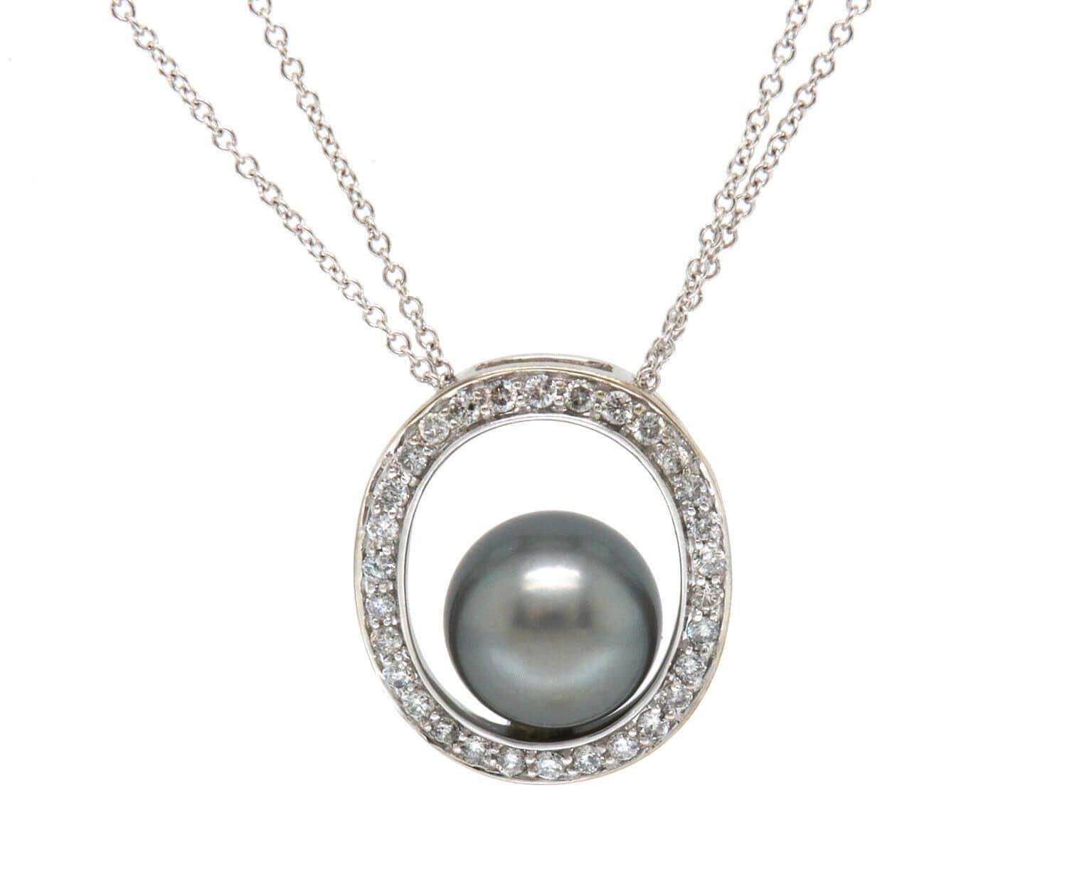 Black Pearl and Diamond Halo Pendant Necklace in 14K

Black Pearl and Diamond Halo Pendant Necklace
14K White Gold
Pearl Size: Approx. 9.6 MM
Diamonds Carat Weight: Approx. 0.18ctw
Pendant Dimensions: Approx. 16.0 X 19.0 MM
Necklace Length: Approx.