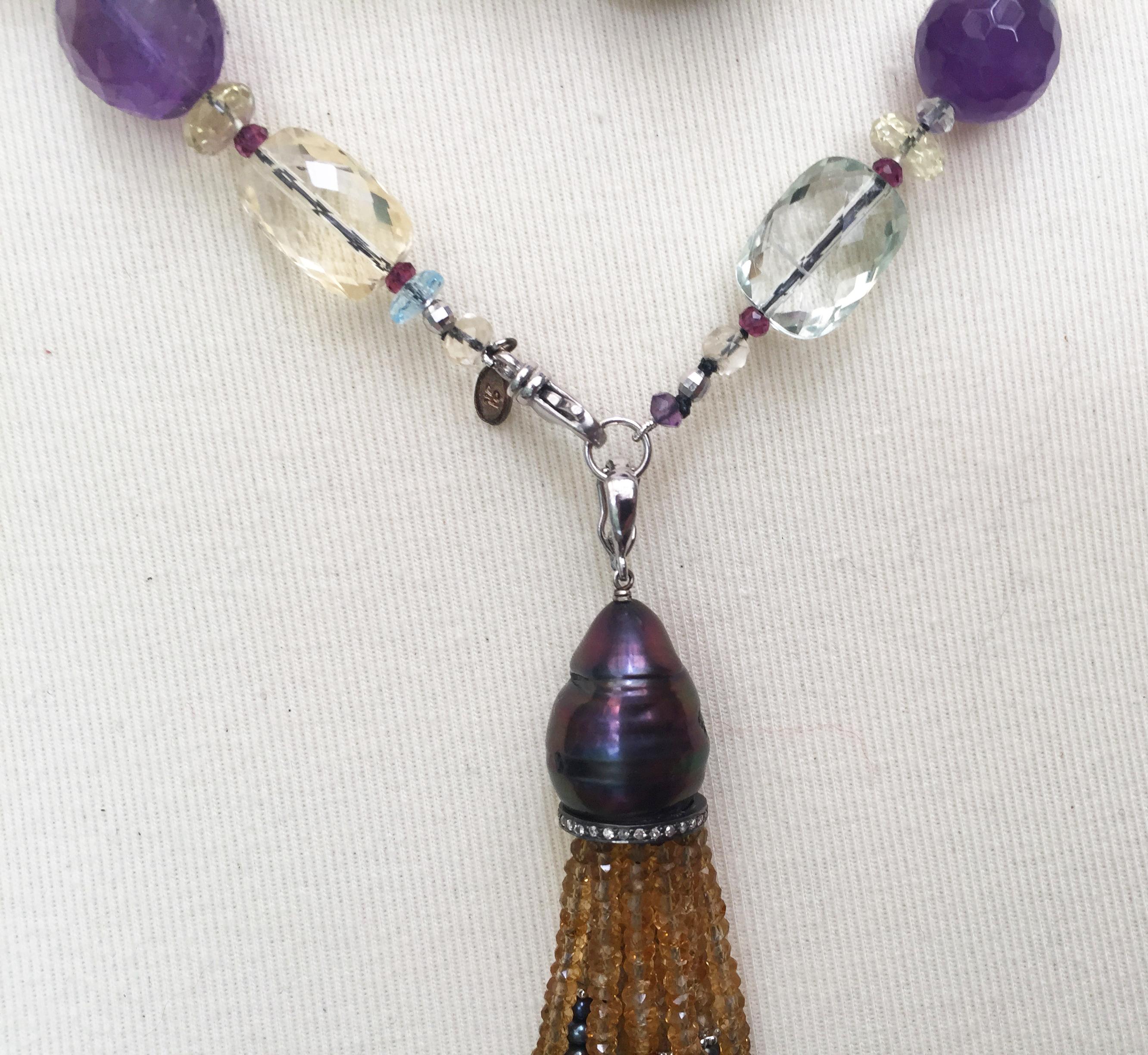 This black pearl and multi-color semi precious lariat  is highlighted with a 14k white gold clasp and beads. Marina J. hand selected the citrine, amethyst, green amethyst, aquamarine, garnet, and blue topaz, to create a colorful and elegant lariat.