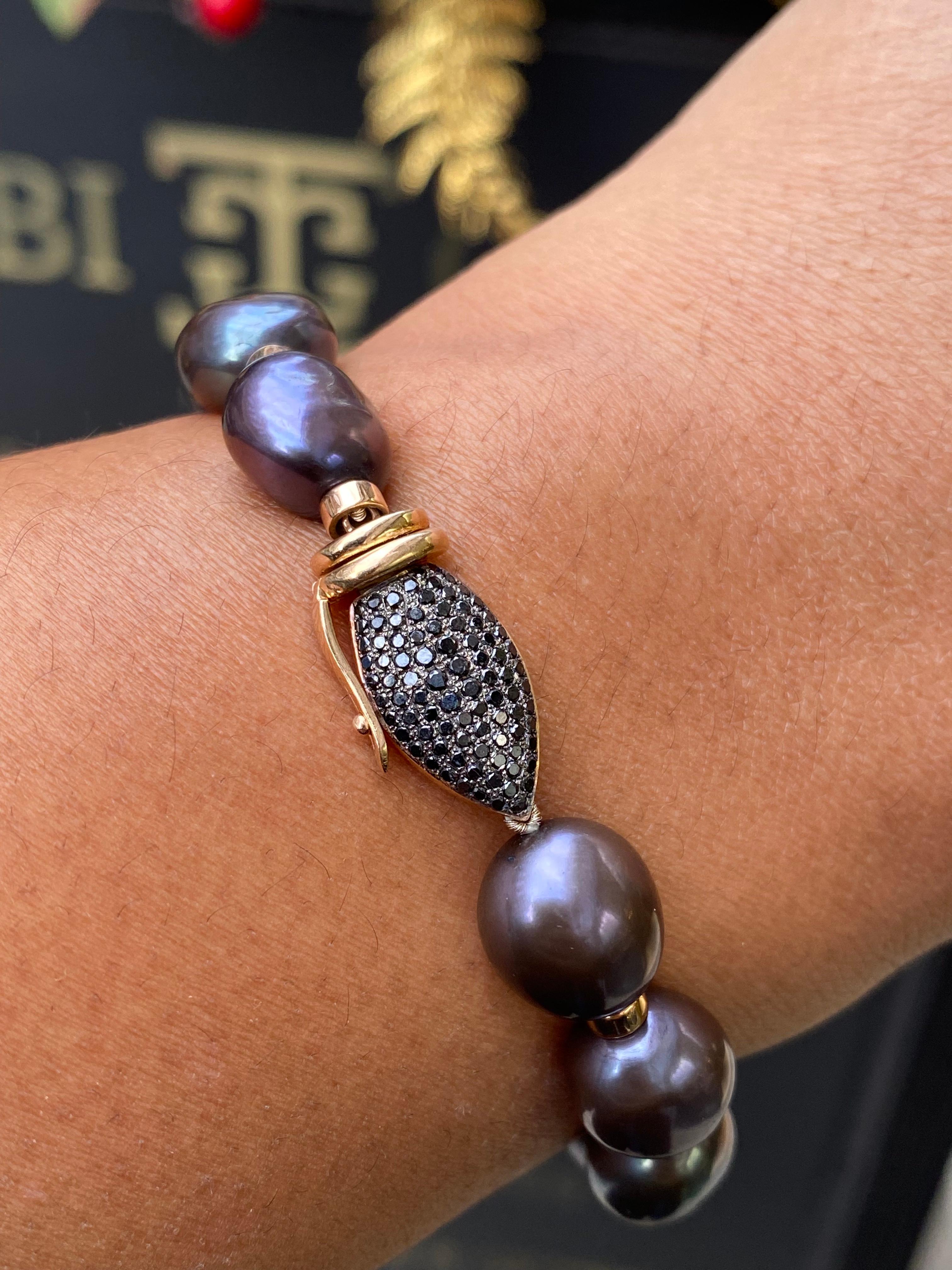 Get ready to fall in love with this absolutely stunning pearl, black diamond and 18 carat rose gold bracelet, that is new to our exquisite jewellery collection.

The bracelet features a captivating array of 12 lustrous black off-round pearls, each