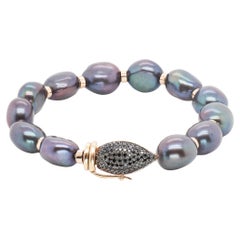 Bracelet perles noires avec fermoir en or rose 18 carats et diamants noirs