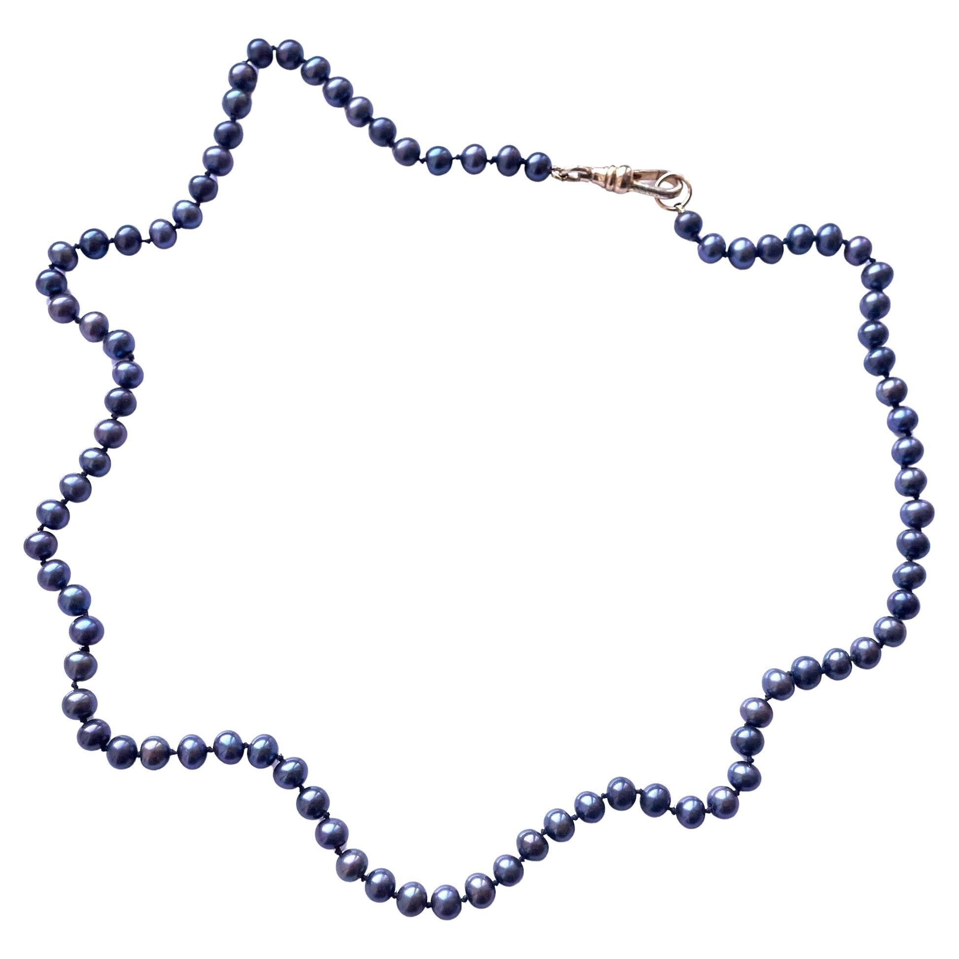 Collier ras du cou en perles noires J Dauphin en fil de soie