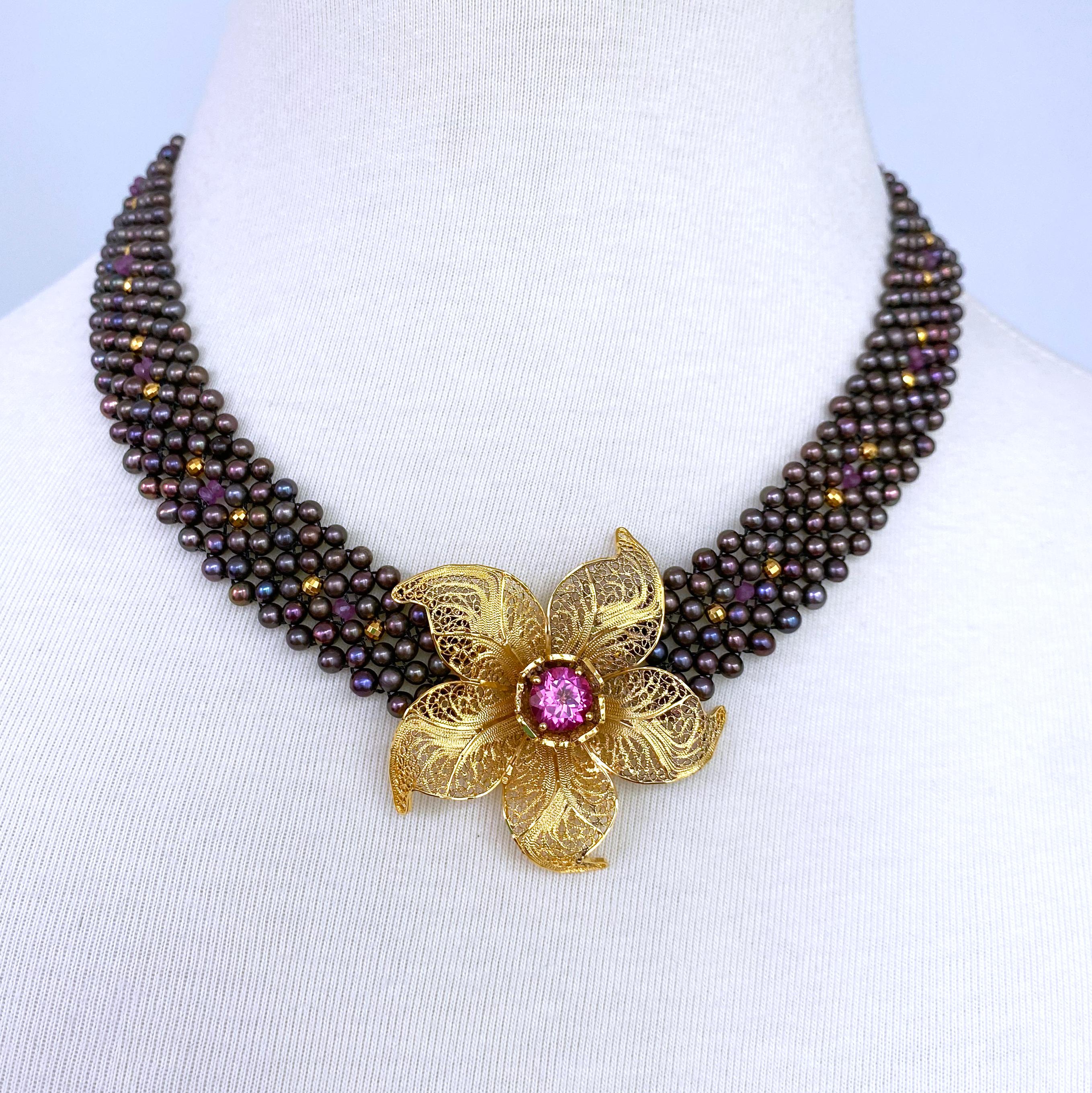 Stunning One of A Kind Necklace by Marina J.

This piece is made using all Black Pearls woven together into a tight lace like design. The Black Pearls hold a red undertone while displaying stunning multi color iridescence and luster. The Black Pearl