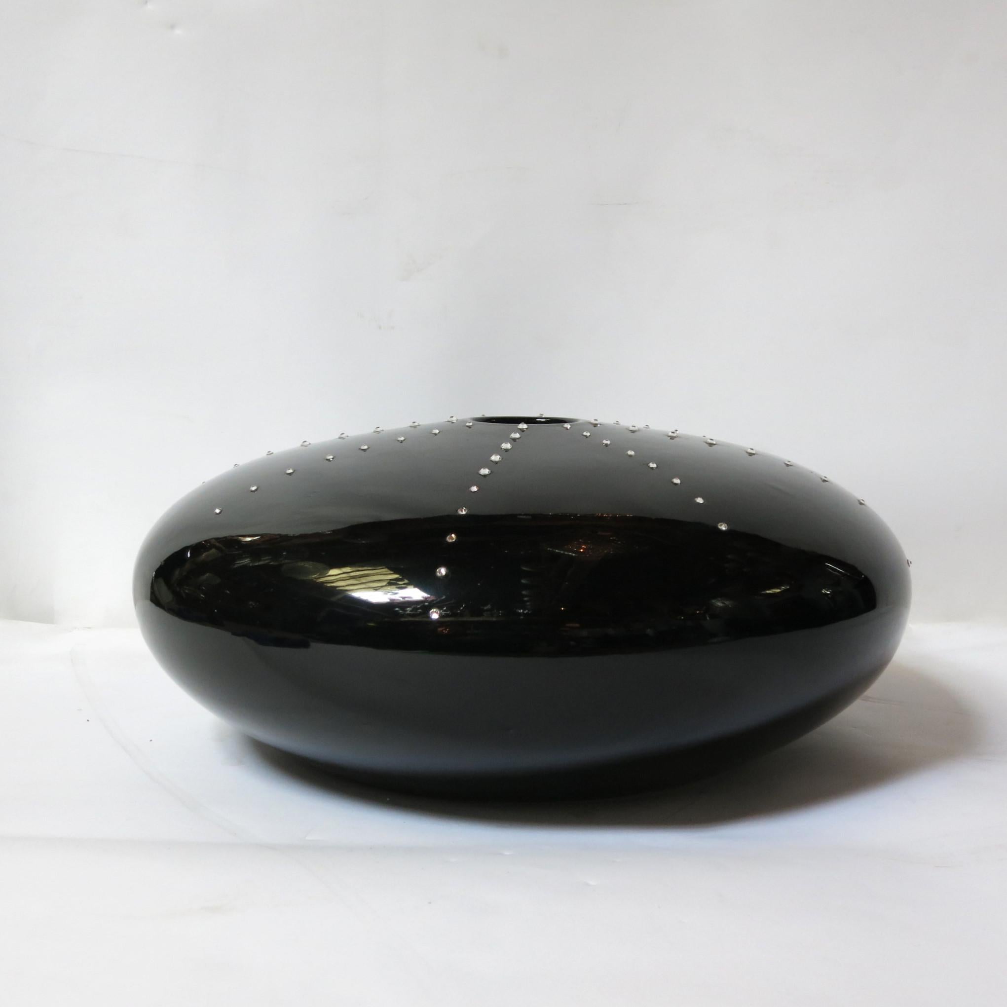 One of a kind pebble shaped black ceramic vase with Swarovski crystals / Designed by Fabio Bergomi / Made in Italy
Diameter: 19 inches / Height: 7 inches
1 in stock in Palm Springs currently ON FINAL CLEARANCE SALE for $799!!!
This piece makes for a