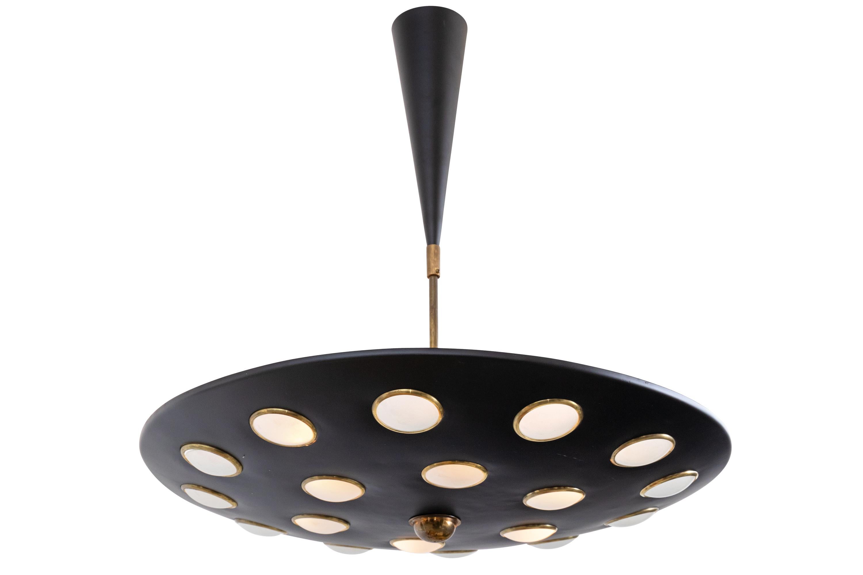 A great looking period chandelier that can be adjusted for height giving it great flexibility. Each diffused glass disc is set in a brass ring creating a soft downward light while still allowing for a significant source of light upward. The light as