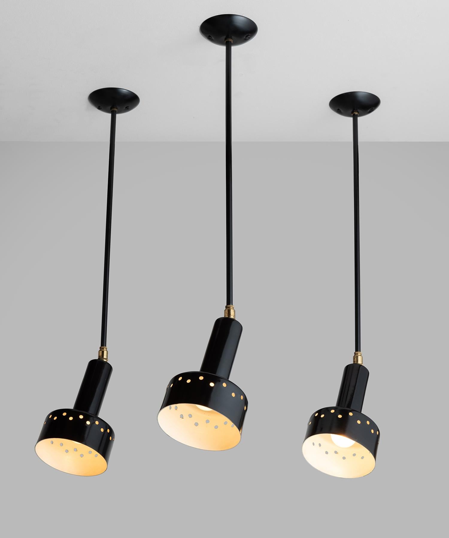 Black perforated metal ceiling mount light, France 1950.

Black metal fixture with pivoting shade and brass detail.