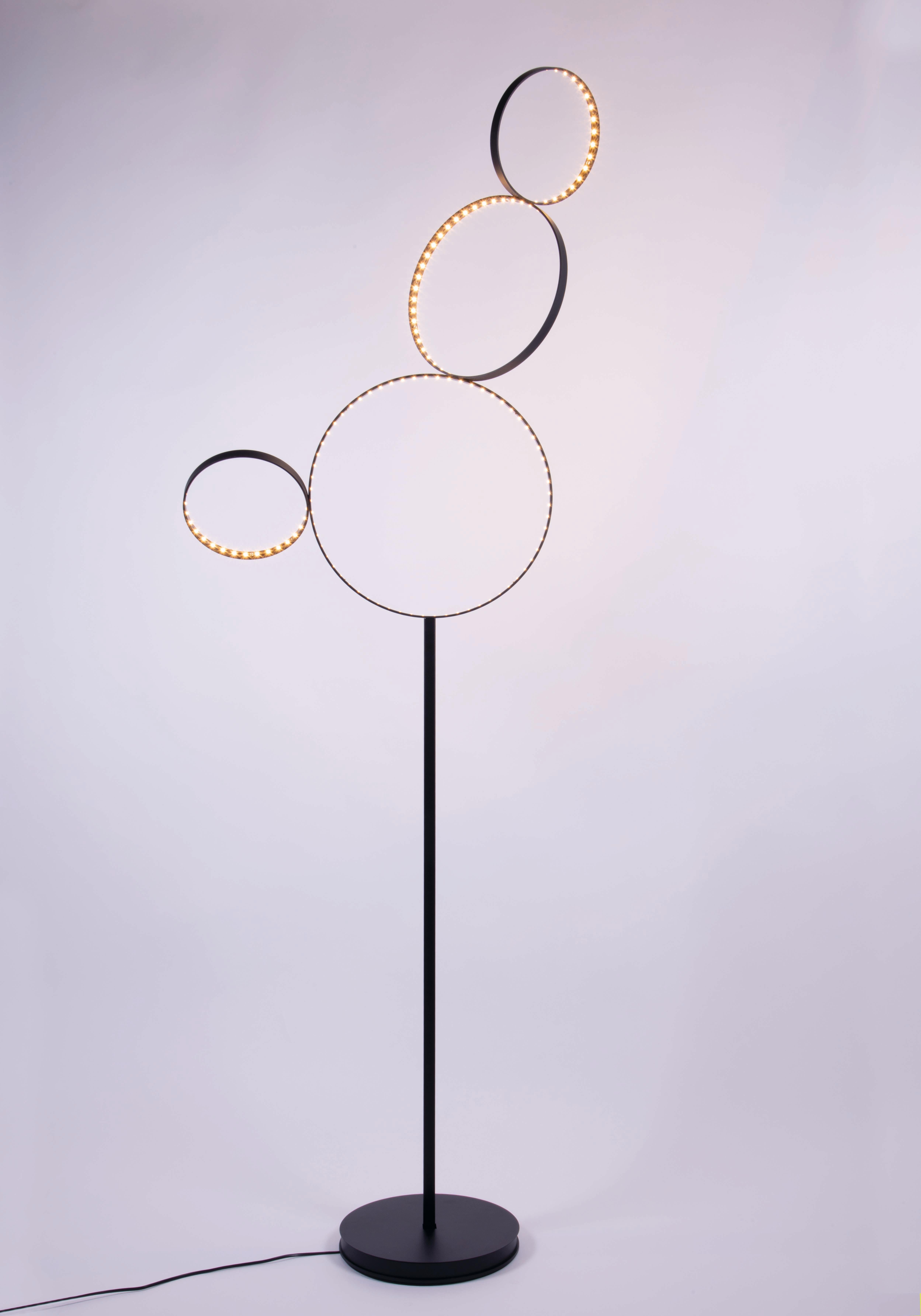Black Pico 5 Floor Lamp by Le Deun Luminaires
Dimensions: W 80 x D 80 x H 202 cm. 
Materials: Epoxy painted steel.

They are a French company established in 1997, specializing in designing and manufacturing low-energy consumption lighting. They have