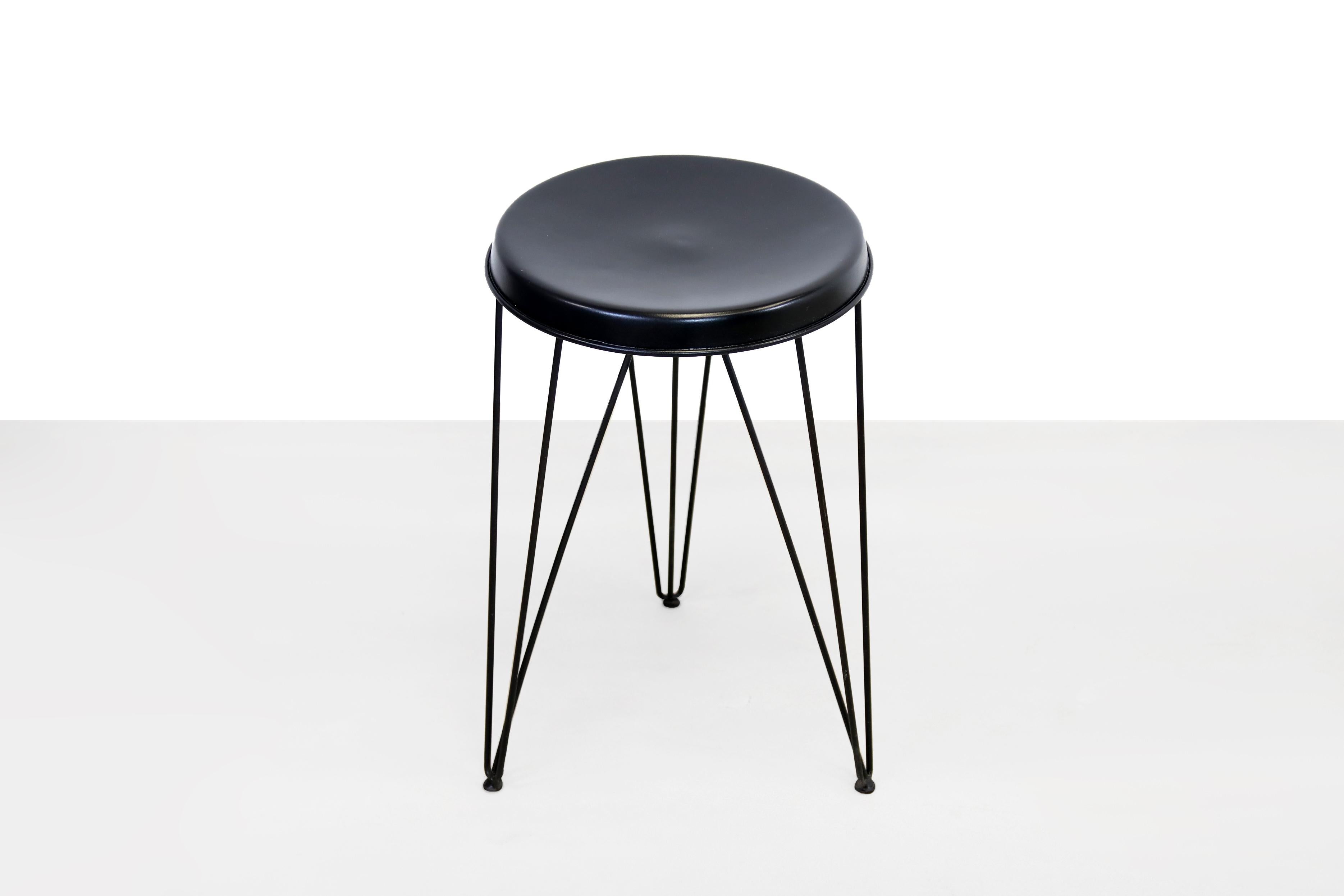 Very nice Minimalist stool by Tjerk Reijenga for Pilastro. The black lacquered wire steel base is special. The legs are a feast for the eyes. The seat is black lacquered metal. An eye-catcher for any interior. Intended as a stool, but can also be