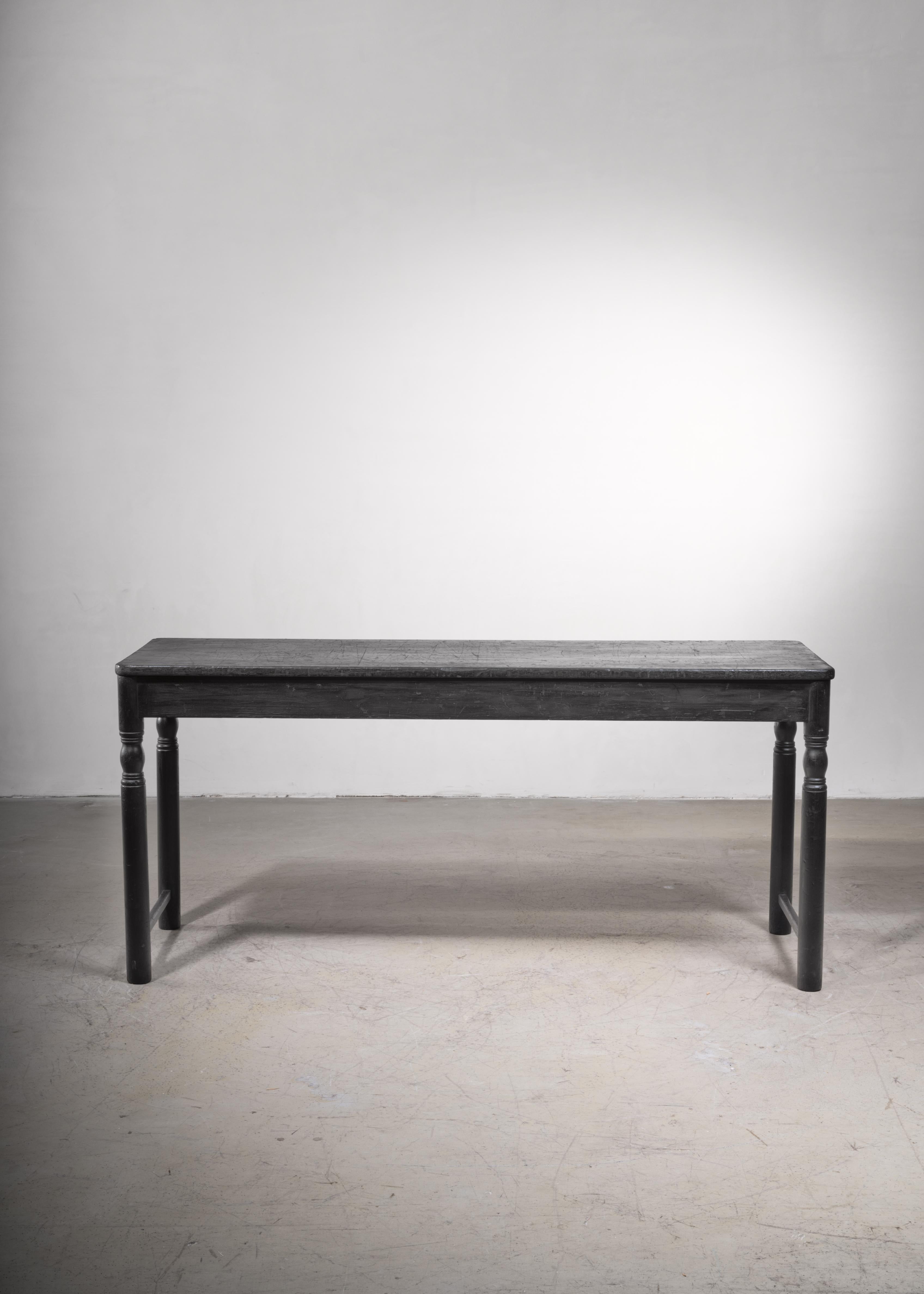 A late 19th century rectangular pine console or working table from Sweden. The table has turned legs and is restored back to its original black paint.