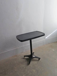 Black plastic side table with wheels