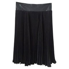 Black pleated skirt by Diane Von Furstenberg with a faux leather belt