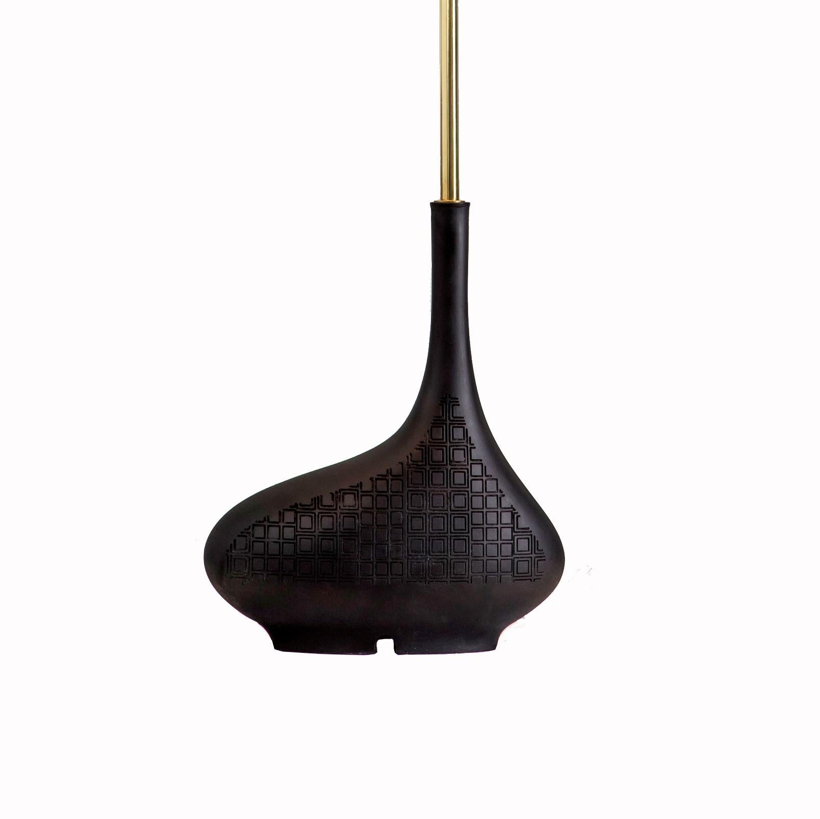 Black Pod single table lamp by Egg Designs
Dimensions: 30 L x 30 D x 58 H cm
Materials: Composite casting, brass, raffia

Founded by South Africans and life partners, Greg and Roche Dry - Egg is a unique perspective in contemporary furniture