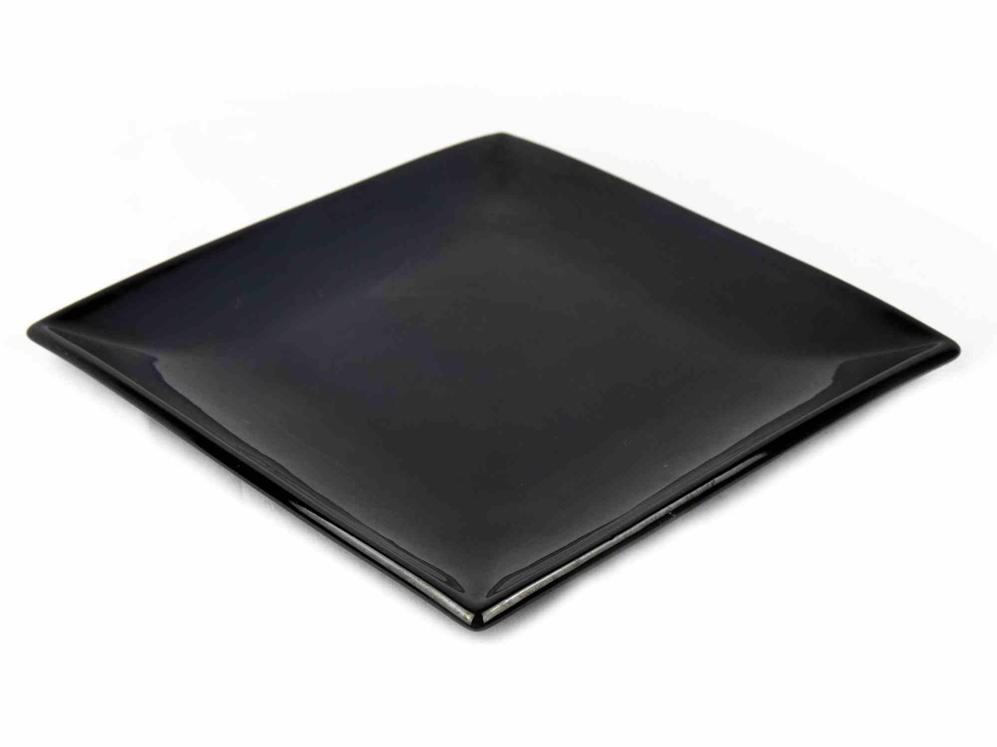 Black porcelain plate is an original decorative object realized in the 1970s.

A very elegant porcelain plate black colored realized by Olympia Porcelain (as reported under the base).

Good conditions except for some light scratches.