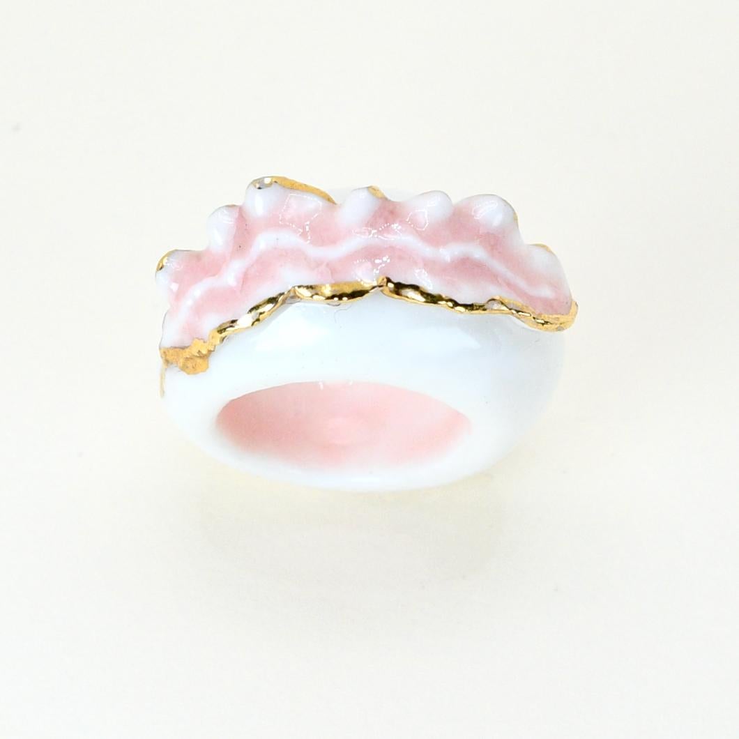 Porcelain  24K gold  Handmade in London

A perfect summer piece, the ALBA Porcelain Ceramic Ring is made from the whitest porcelain and decorated with a blush rose colored leaf with golden outlines. The look is light, airy, and graceful; perfect for