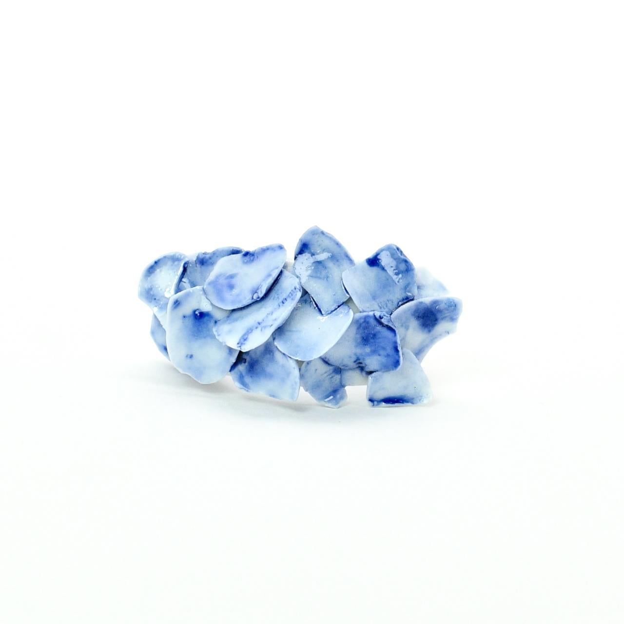 Porcelain  Handmade in London

Introducing PLENEAU Porcelain Ceramic Ring that is pure art in its functional form. Crafted from the finest porcelain, this piece resembles a stunning shard of ice pieces, creating a wearable sculpture that exudes