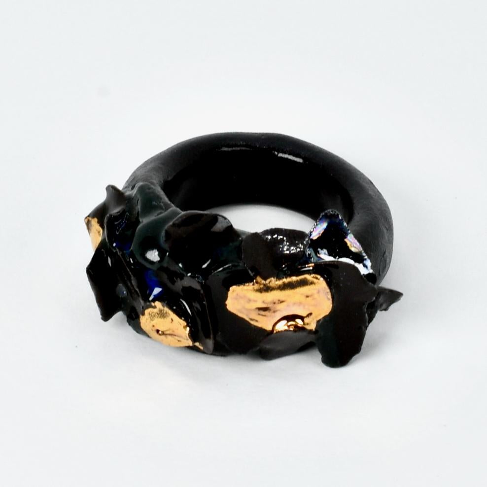Porcelain  24K gold embellishment  Handmade in London

Rings made from black onyx porcelain, ceramic are a rare find. RUAPEHU Black Porcelain Ring design evokes the exploded peaks and craters of Ruapehu volcano. This ring is handmade from the rare
