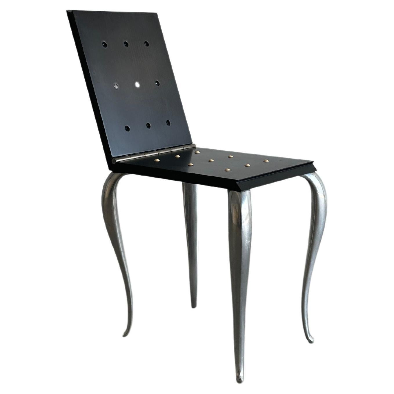 Black postmodern Lola Mundo folding chair/stool by Philippe Starck for Driade 