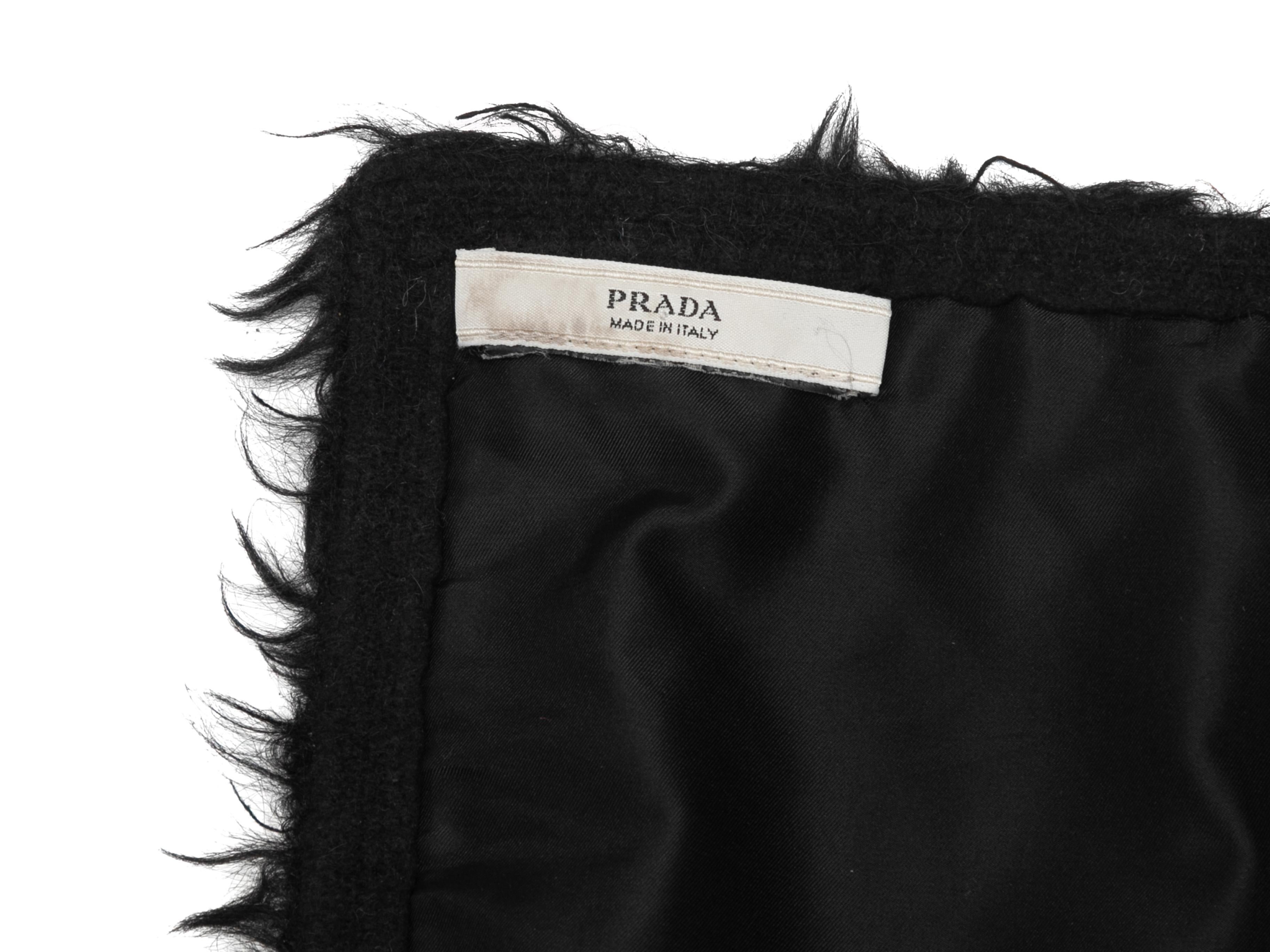 Black lamb fur scarf by Prada. 8