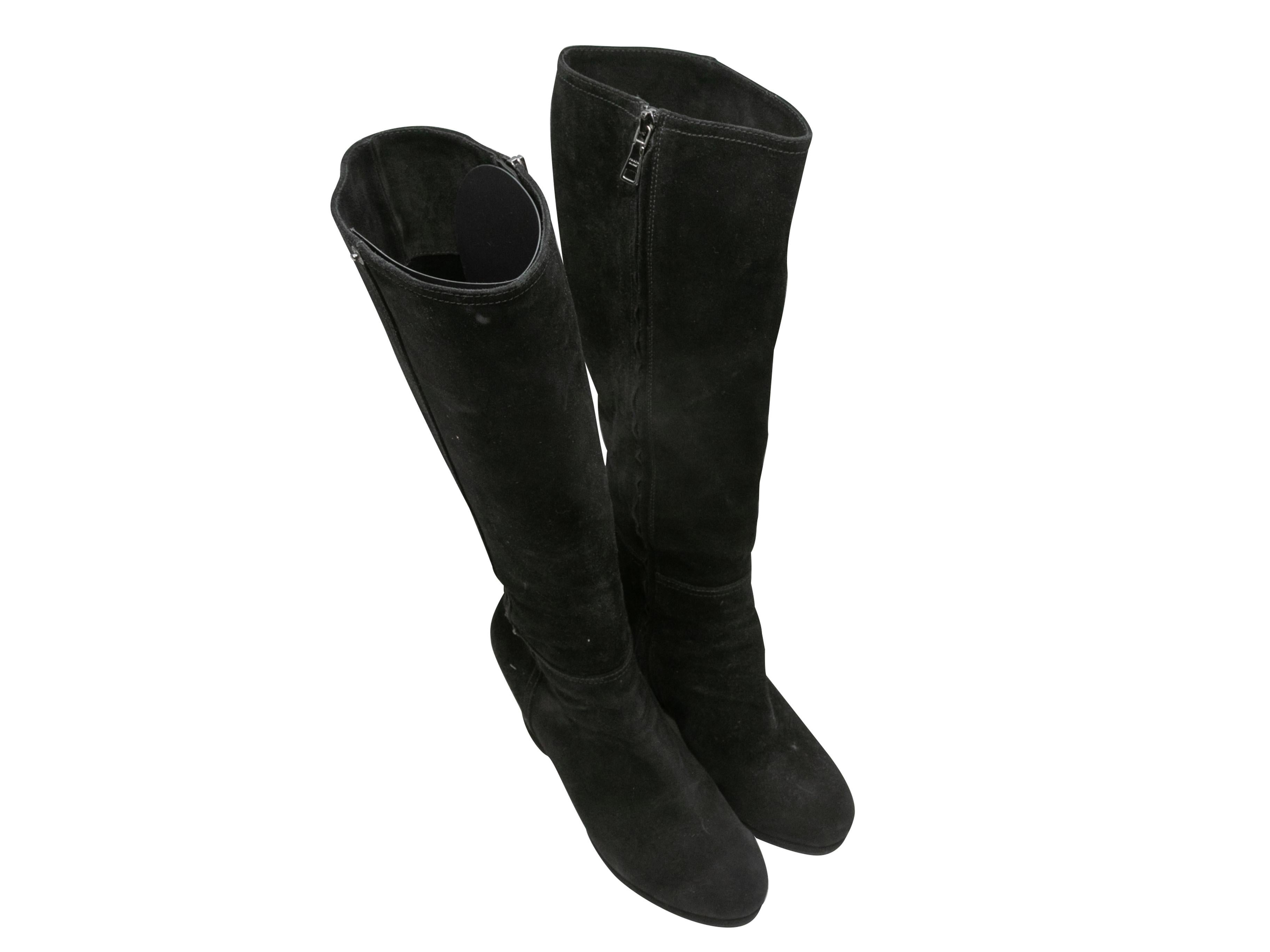 Black suede knee-high wedge boots by Prada. Zip closures at inner sides. 14.75