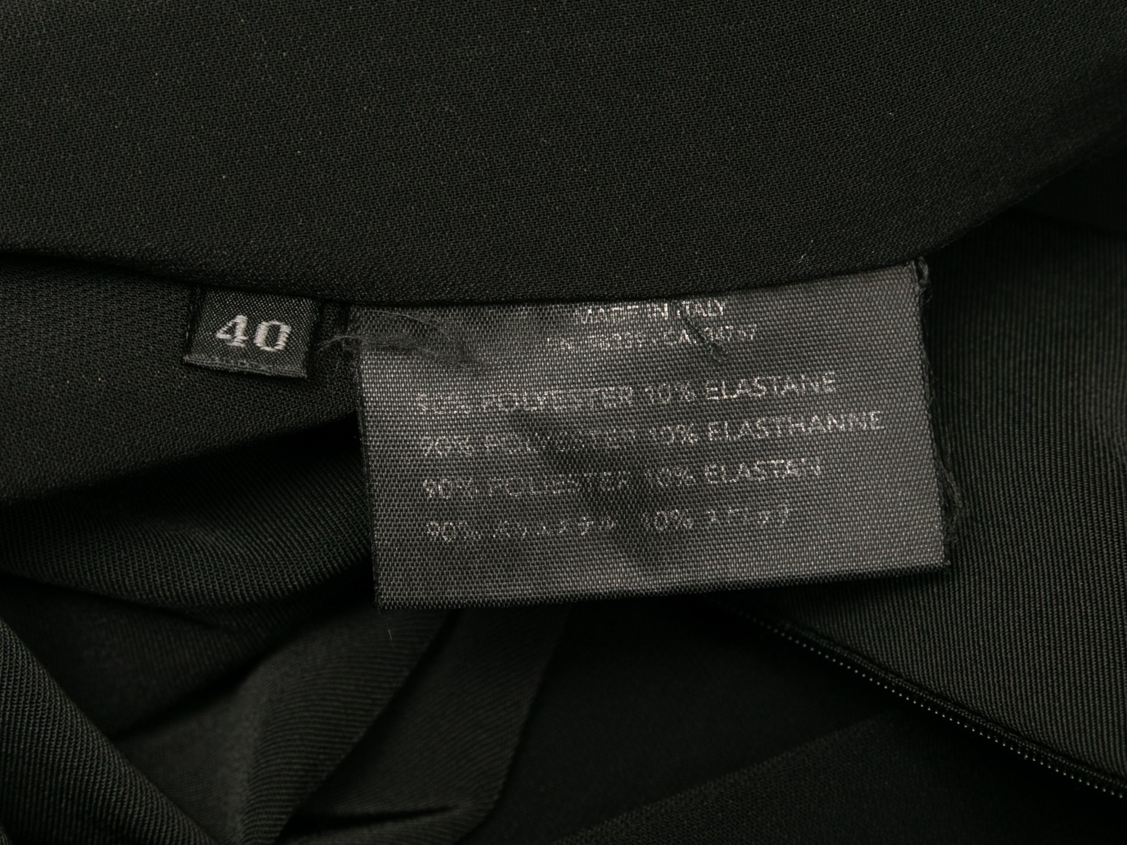 Black sleeveless midi dress by Prada. V-neck. Zip closure at back. 31