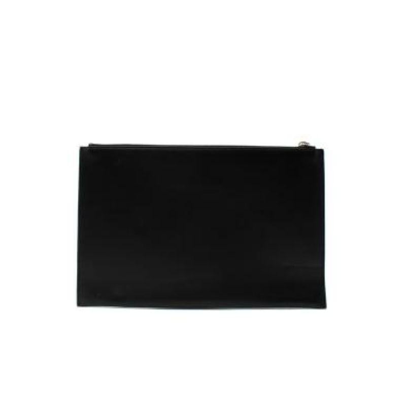 Dior Black Printed Leather Pouch
 

 - White printed star CD front logo 
 - Silver-tone top zip fastening 
 - Interior embossed dior logo 
 - One interior compartment 
 - Fully lined in black grosgrain
 

 Materials:
 Leather 
 Nylon 
 

 Made in