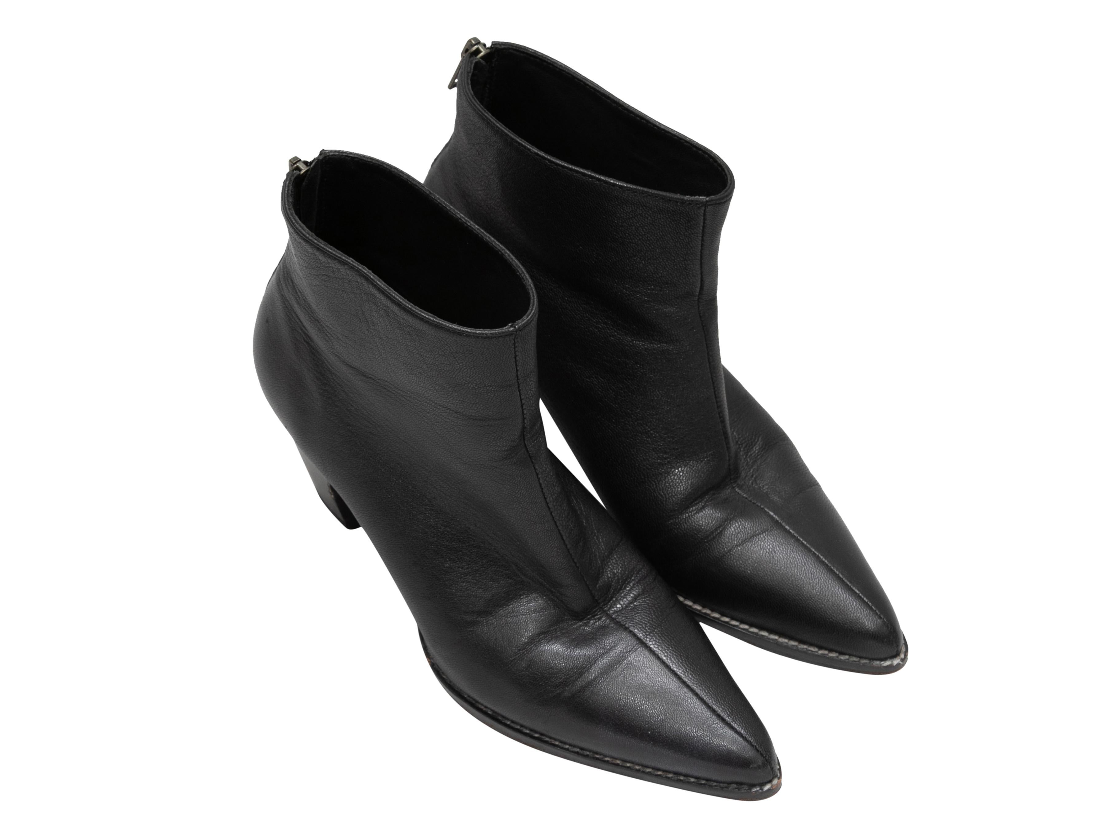 Black leather pointed-toe ankle boots by Rachel Comey. Zip closures at counters. 2.5