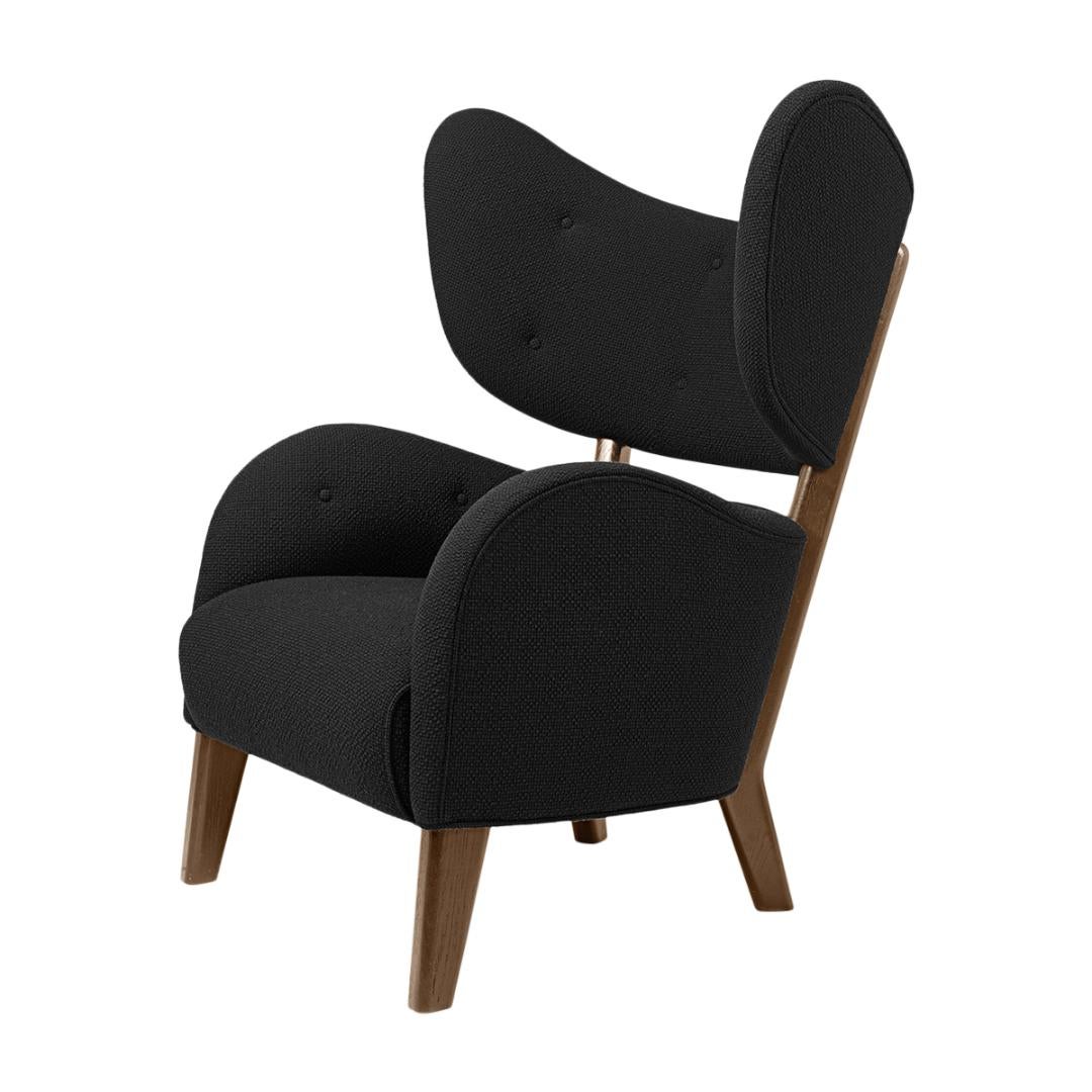 Black raf simons vidar 3 smoked oak my own chair lounge chair by Lassen,
Dimensions: W 88 x D 83 x H 102 cm.
Materials: Textile.

Flemming Lassen's iconic armchair from 1938 was originally only made in a single edition. First, the then