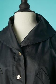 Black raincoat with branded snap and gold metal eyelet Nina Ricci