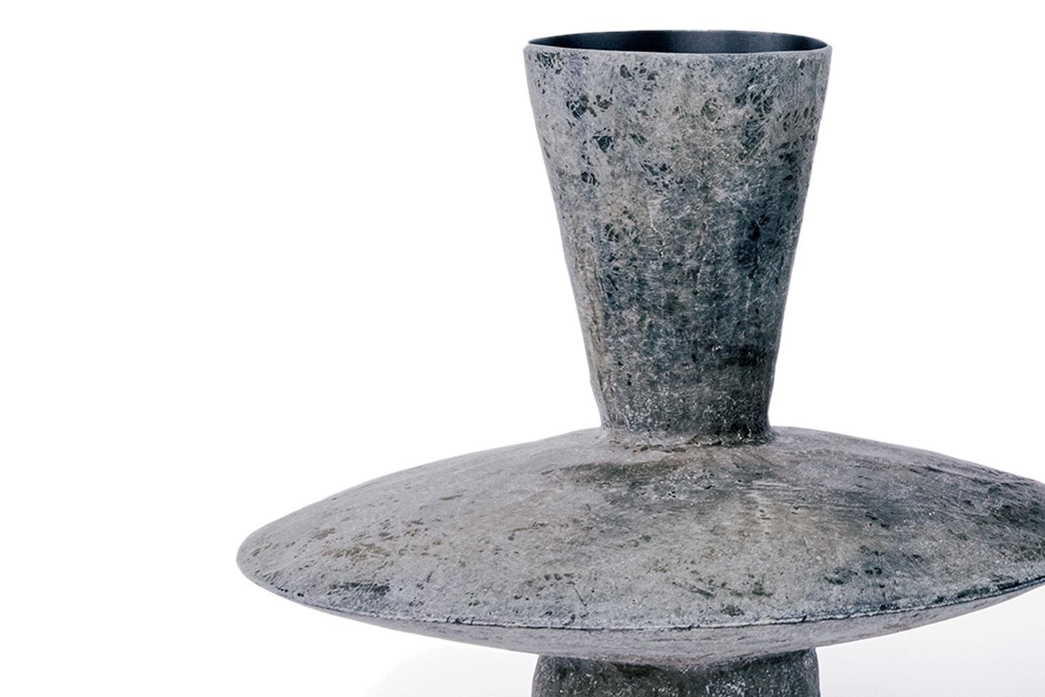 Echo Low By Imperfetto

Made from fiberglass with a raw exterior finish and a black smooth interior basin. The design of peculiar geometries makes this vase a unique object with a distinctive character. Echo high vessel has a round basin for objects