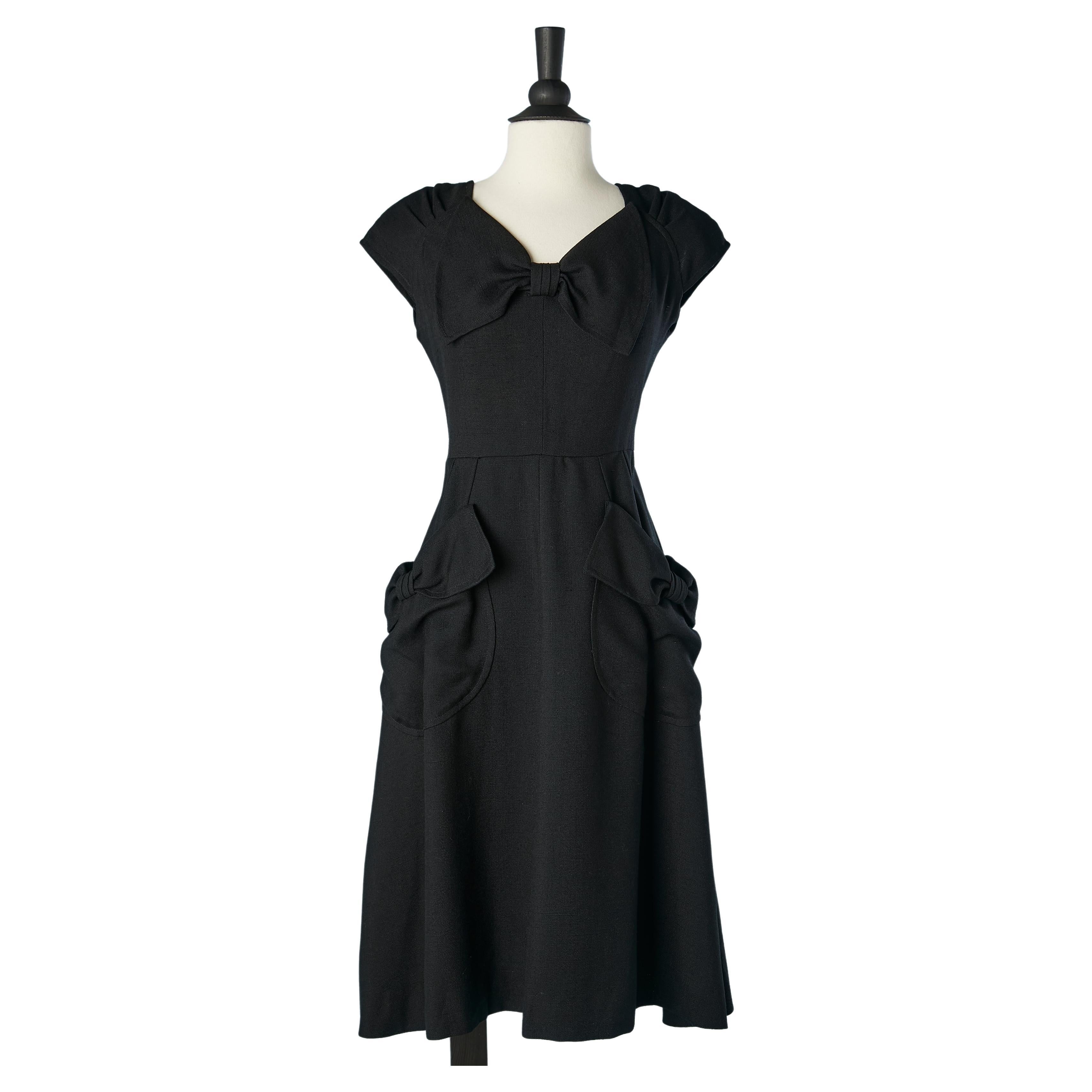 Black rayon cocktail dress with bow and bow on pockets Nina Ricci Boutique