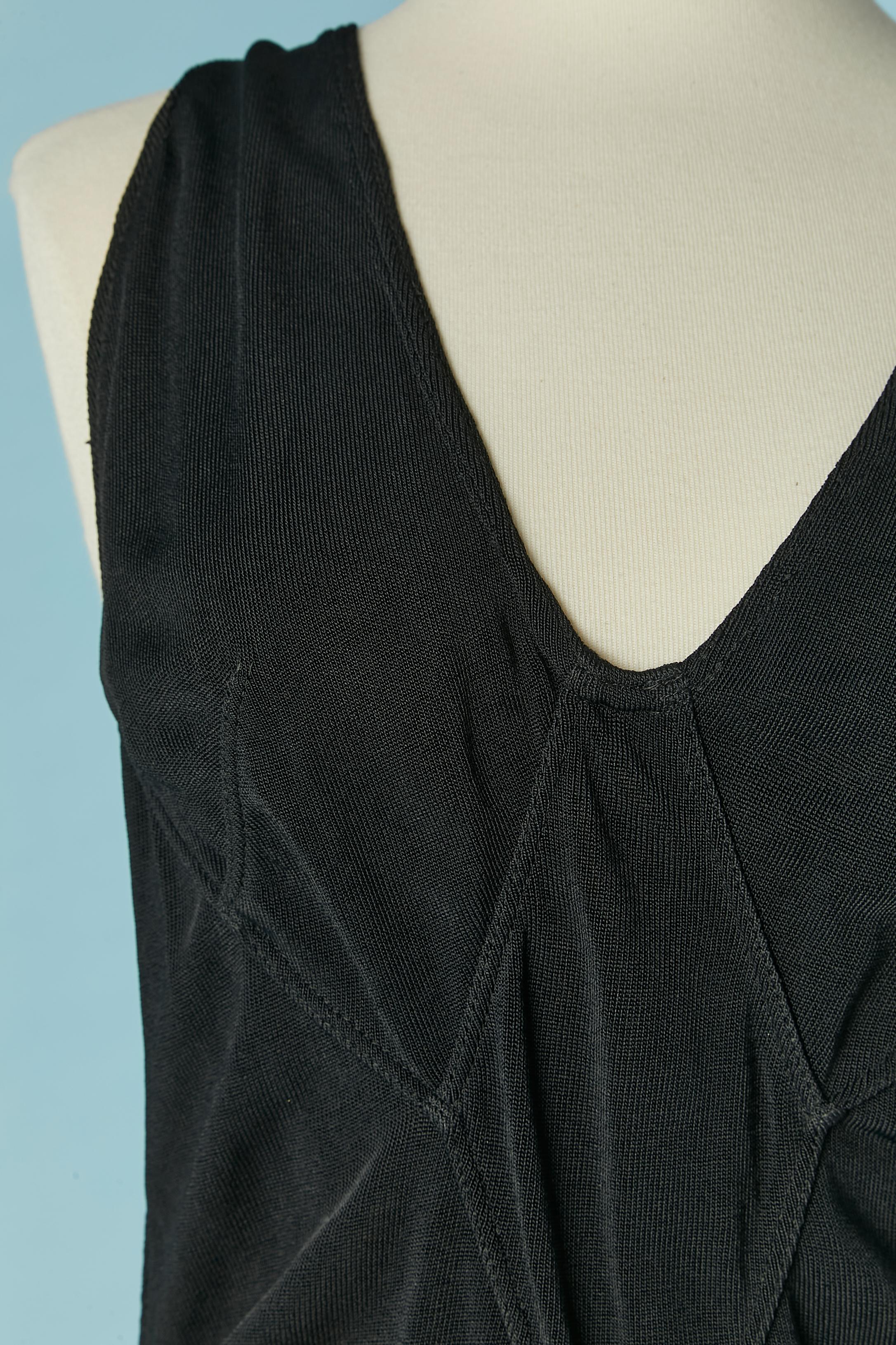 Black rayon jersey bodysuit . Snap closure in between the legs. Cut-work 
Size S on tag but fit more likely L 
