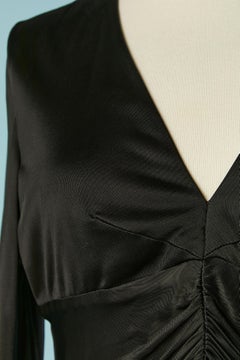 Black rayon jersey cocktail dress draped on the front VERSACE