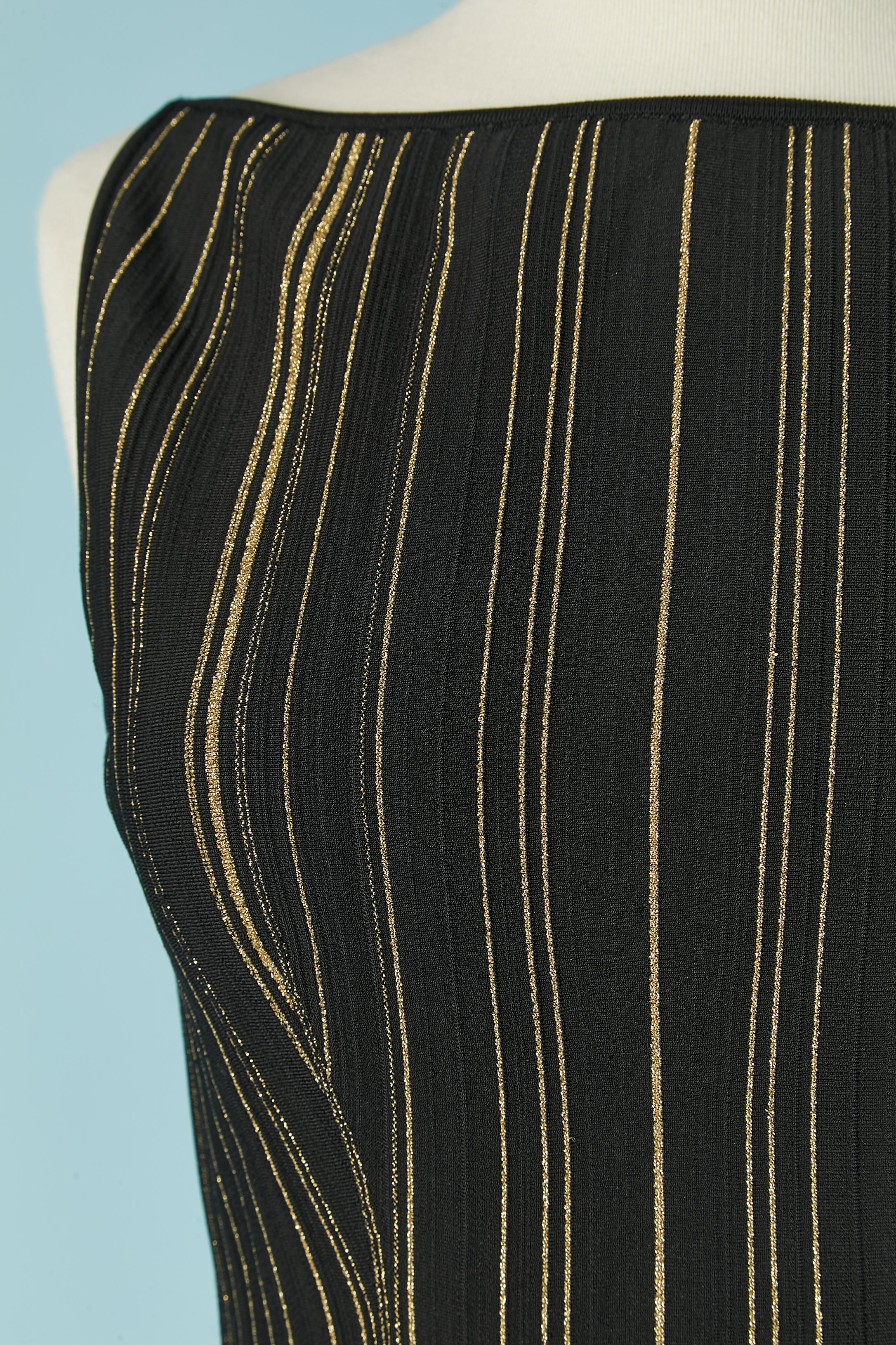 Black rayon sleeveless cocktail dress with gold lurex lines . Fabric composition: 65% rayon, 26% nylon, 7% elastane, 2% metallized polyester. Invisible zip on the left side. 
NEW WITH TAG.
SIZE 38 (It) 34 (Fr) XS 