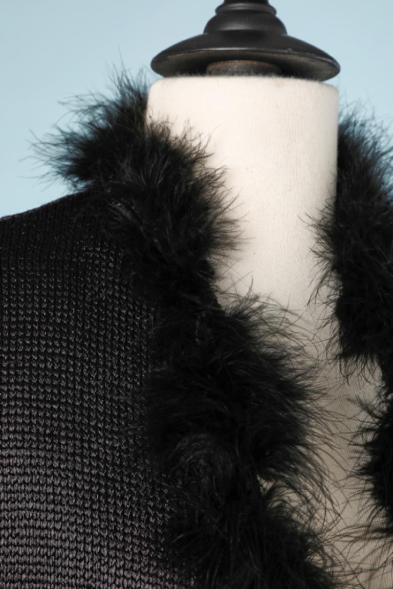  Black rayon knit ensemble with feathers edge.
SIZE M
