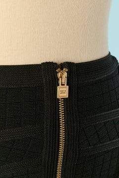 Black rayon knit skirt with gold metal zip HERVE LEGER