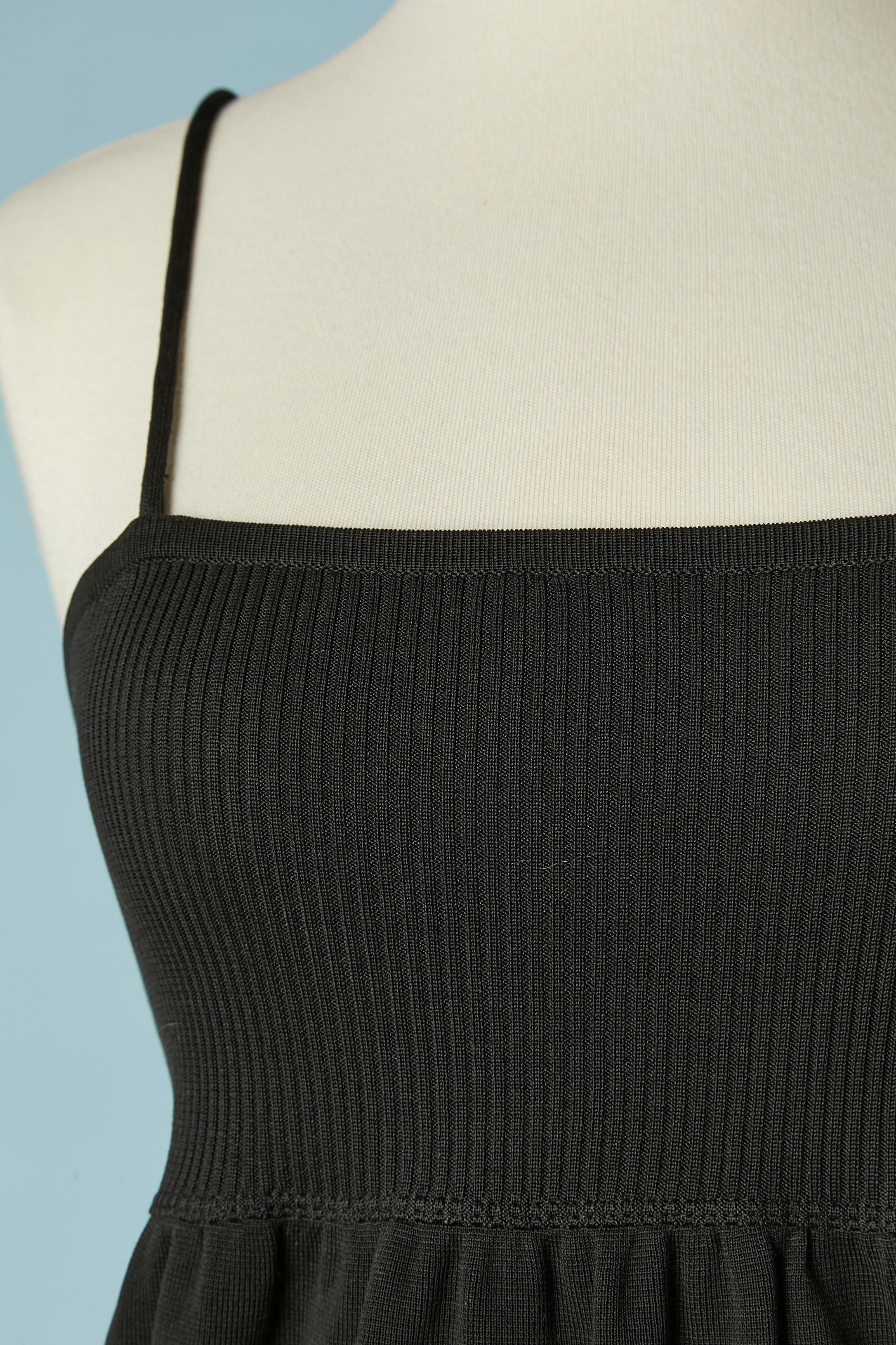 Black rayon knit slip dress with branded buttons closure and buttonhole on the back.
Pockets on both side. 
SIZE 34/36 (Fr) XS 