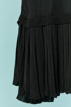 Black rayon sleeveless dress with pleats on the bottom ALAIA