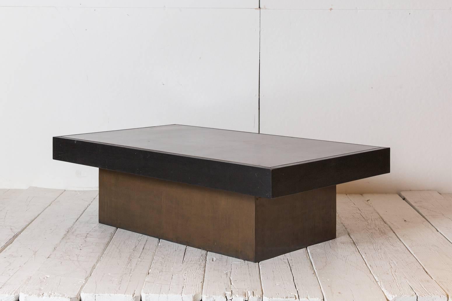 Black rectangular blocked coffee table with copper inlay.