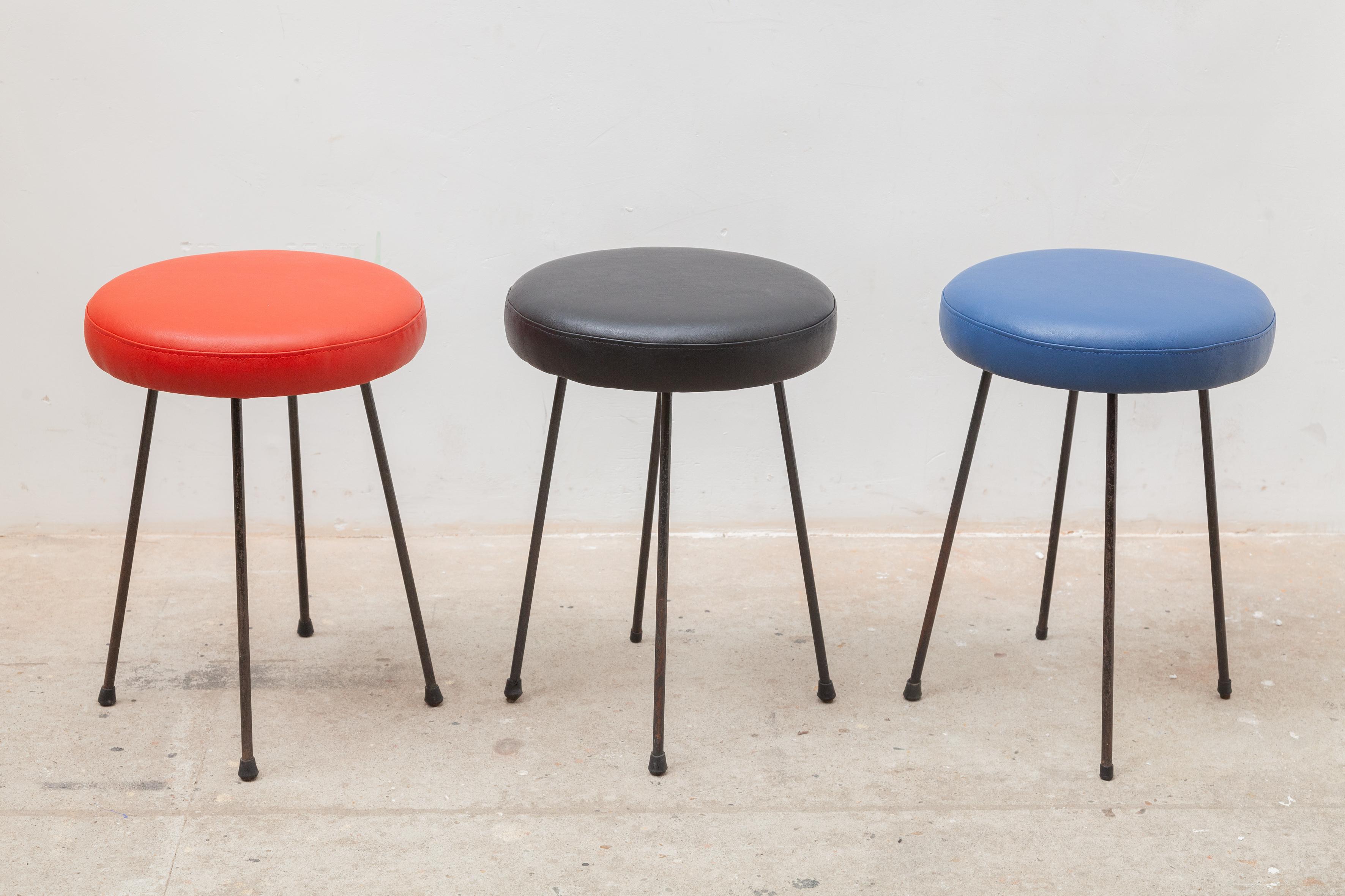 These fifties tri-colored low stools in wrought iron and reupholstered leather was designed in France 1953. Price a set.