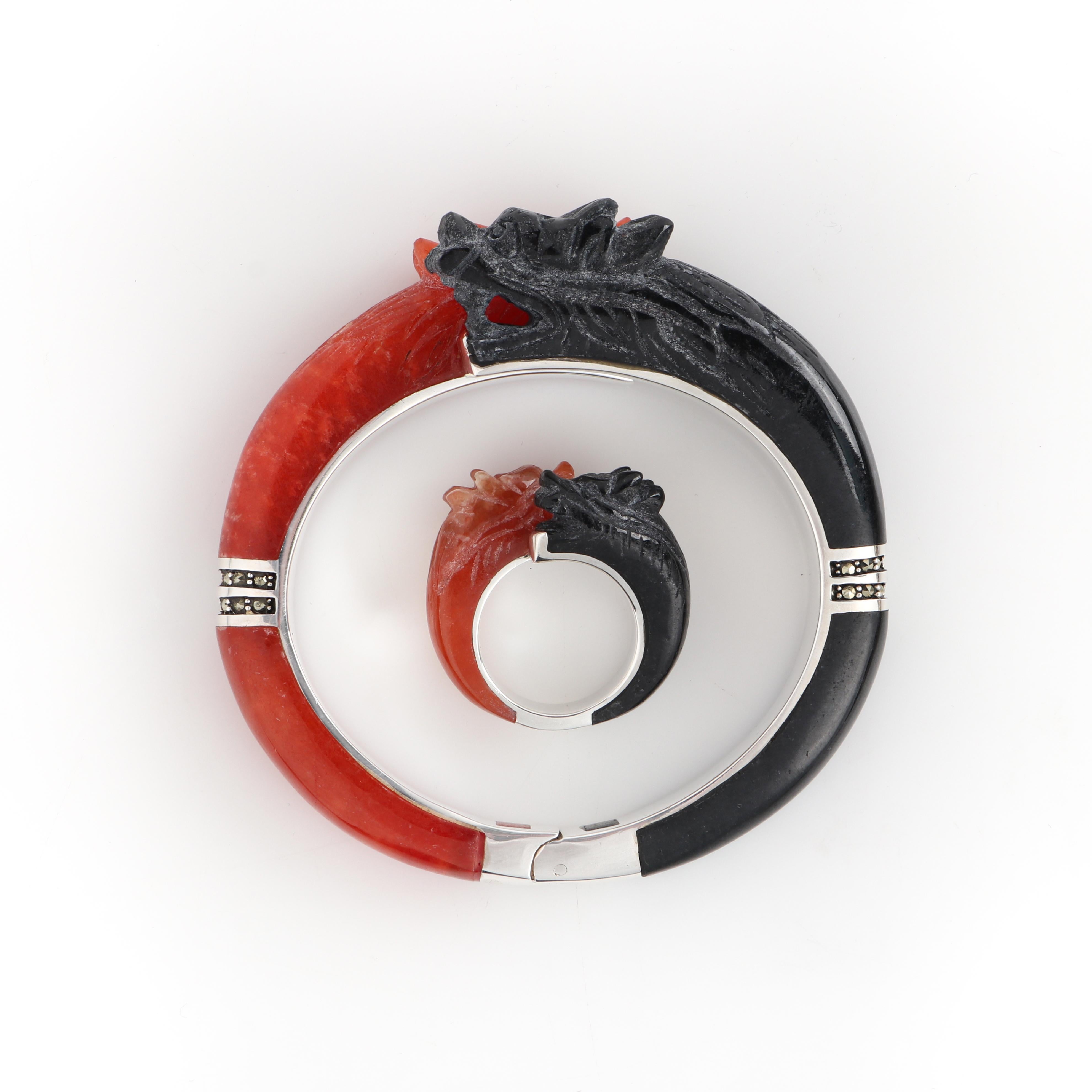 Black & Red Carved Stone Double Dragon Sterling Silver Bangle Bracelet Ring Set
 
Style: Bangle bracelet and ring set
Color(s): Stone: shades of red, black; metal: silver
Marked Material: “925” Silver
Unmarked Material (feel of): Stones: Red