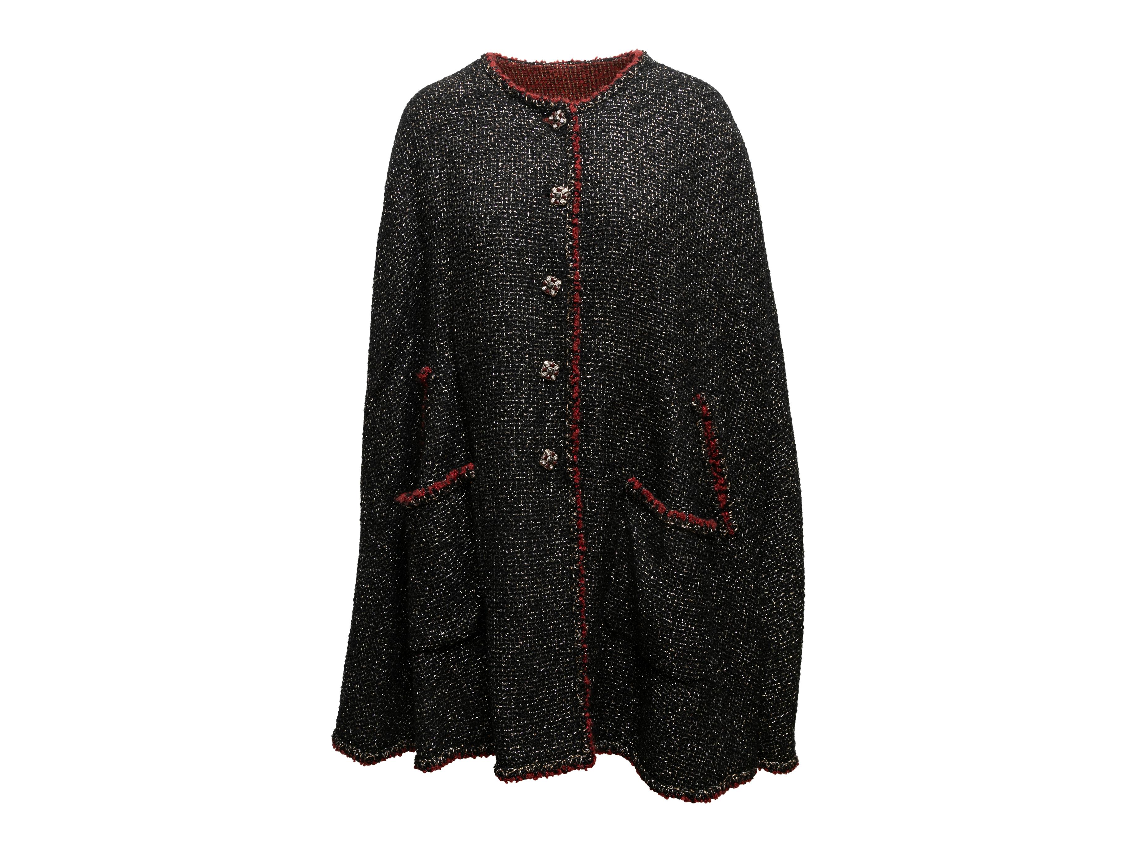 Black and red metallic tweed reversible cape by Chanel. From the Fall/Winter 2006 Collection. Crew neck. Dual pockets. Front button closures 52