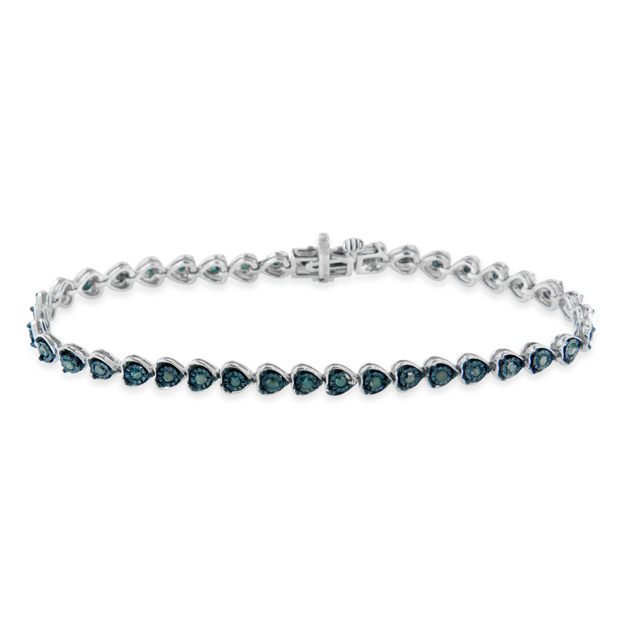This gorgeous .925 sterling silver tennis bracelet features 1.0 carat total weight with 40 round, rose cut diamonds. The tennis bracelet has heart-shaped links with diamonds in the center of each link. The unique miracle-plate setting centers each