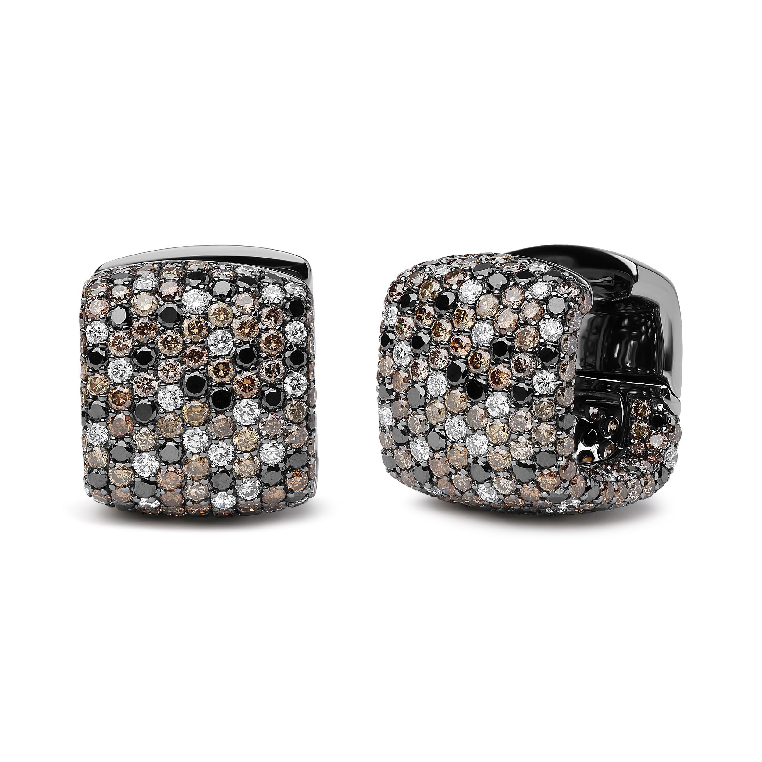 Enhanced by the rich splendor of black rhodium plated 18k white gold, these domed huggie hoop earrings are a style meant to be treasured. An impressive 596 total diamonds shine brilliantly from pave settings in an all-over cluster design so that