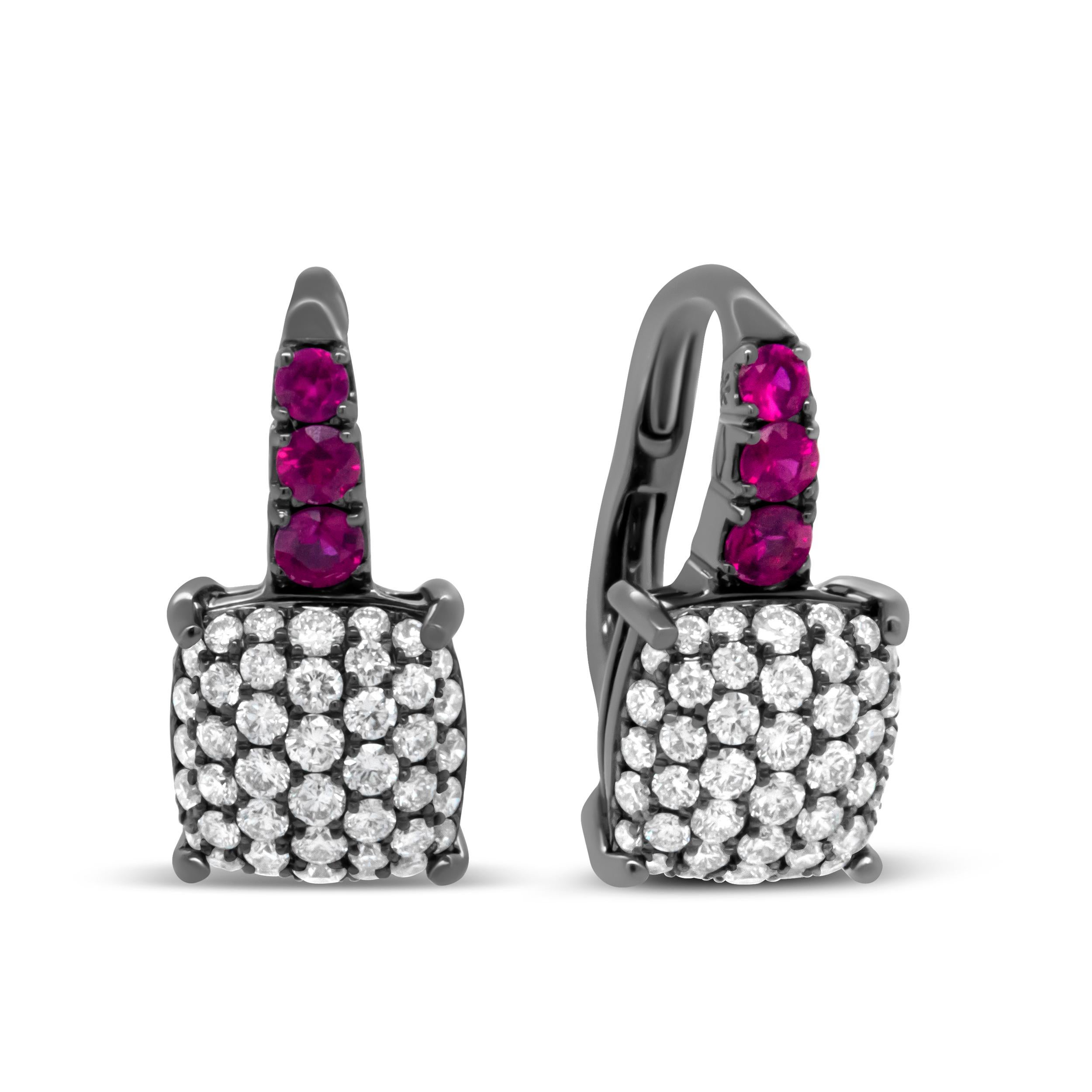 Presenting an exquisite style, this pair of drop earrings celebrates the mystery and vivacity of life with its rich and sexy color palette. Crafted of black rhodium plated 18k white gold, these earrings feature an upper dangle with a graduated