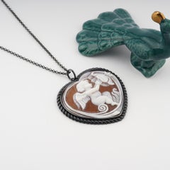 Cameo Italiano. The Cupid hand-carved on Sea shell cameo, heart pendant.