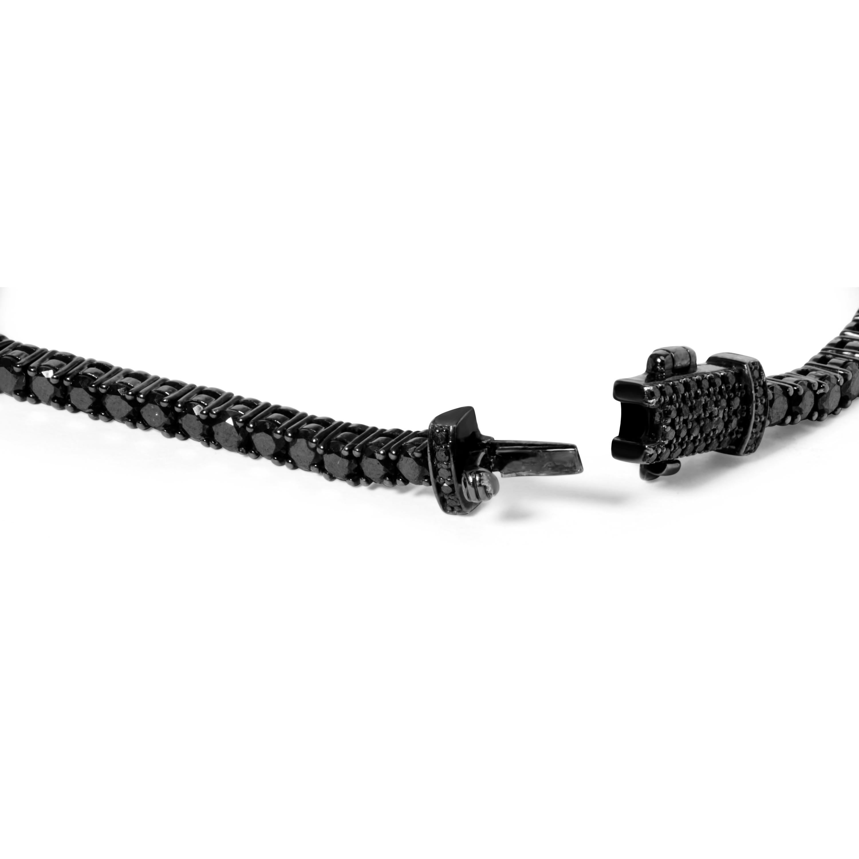 Step into the realm of unparalleled sophistication with our mesmerizing Black Diamond Tennis Bracelet. Crafted from exquisite black rhodium-plated .925 sterling silver, this bracelet exudes an aura of mystique and allure. Adorned with 121 natural