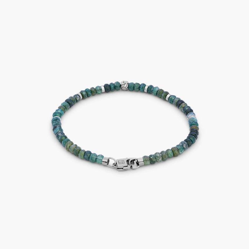Black Rhodium Plated Sterling Silver Nodo Bracelet with Moss Agate, Size L

These men's bracelets feature moss agate and are finished with a black rhodium-plated sterling silver knot bead, discs and matching lobster clasp. The stones are carefully
