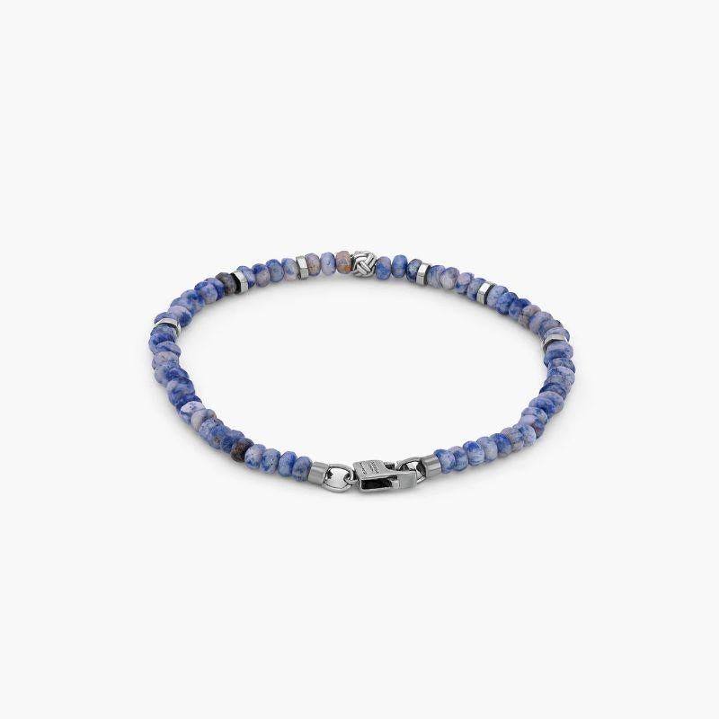 Black Rhodium Plated Sterling Silver Nodo Bracelet with Sodalite, Size L

These men's bracelets feature sodalite and are finished with a black rhodium-plated sterling silver knot bead, discs and matching lobster clasp. The stones are carefully