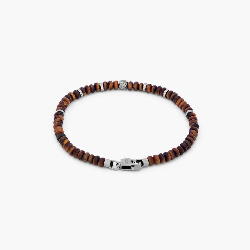 Black Rhodium Plated Sterling Silver Nodo Bracelet with Tiger Eye, Size L

These men's bracelets feature tiger eye and are finished with a black rhodium-plated sterling silver knot bead, discs and matching lobster clasp. The stones are carefully
